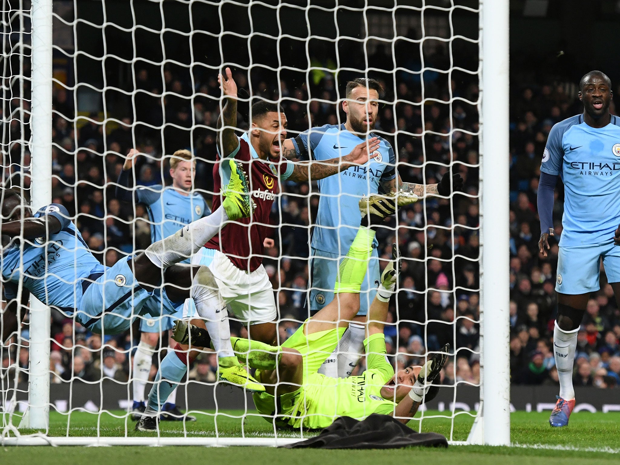 Ben Mee celebrates after grabbing one back for the visitors