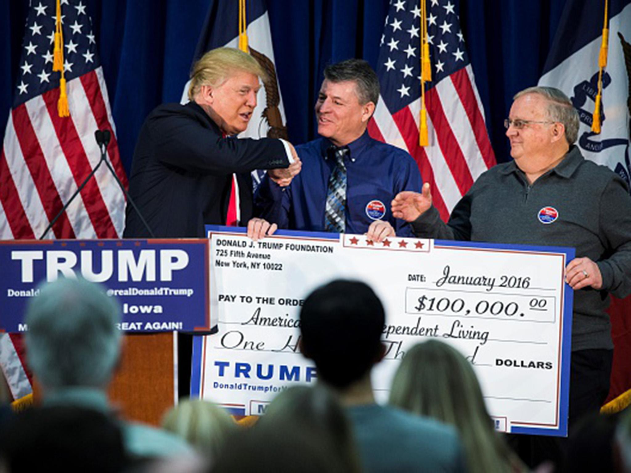 Donald Trump with a campaign contributor in Iowa in January 2016