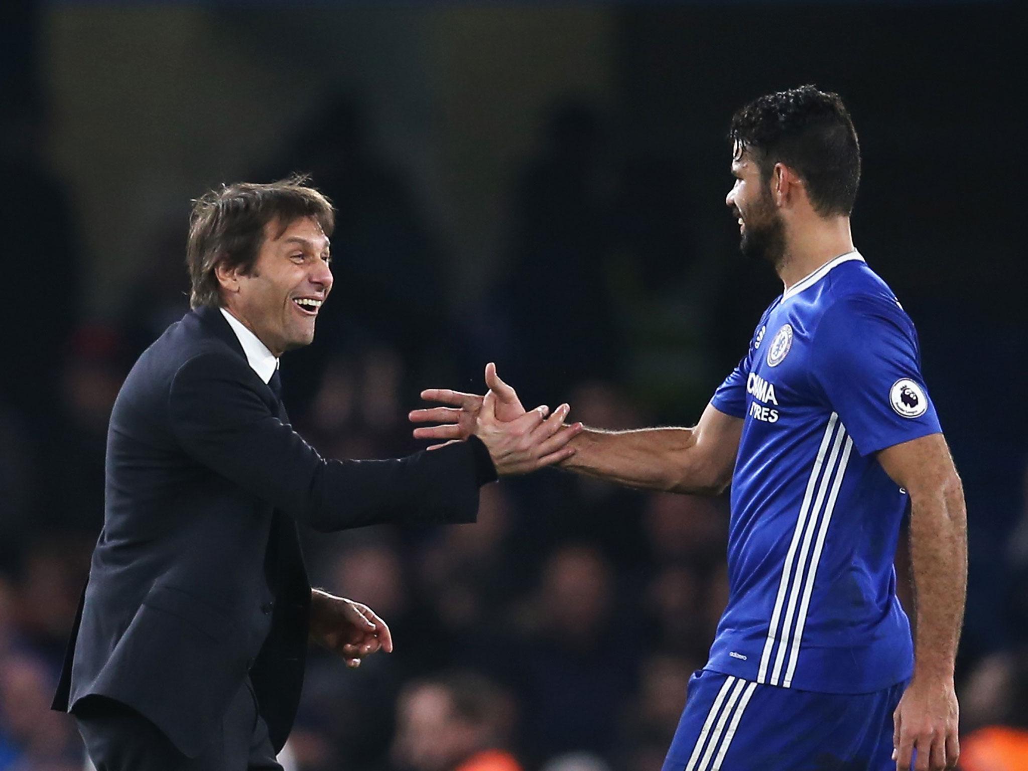 Happier times: Conte congratulates Diego Costa after their side's win over Stoke