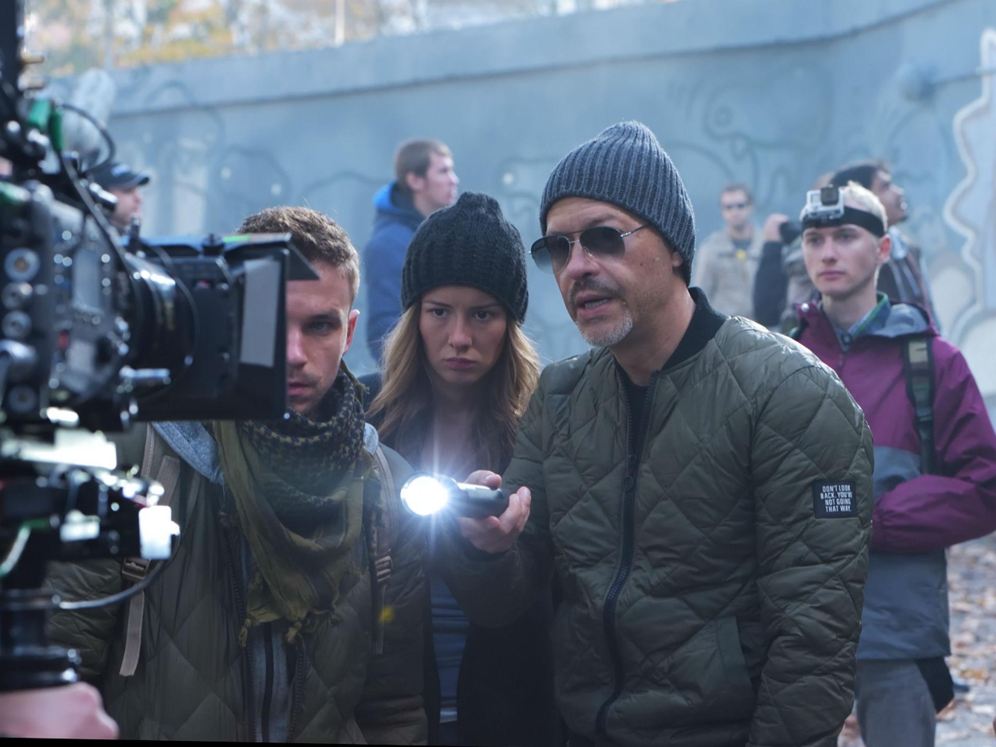 Russian director Bondarchuk behind the camera with some of the cast of his alien invasion film 'Attraction'