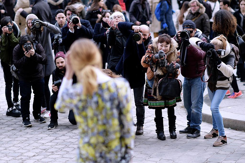 During fashion week, the street style photographers are known to become a bit belligerent