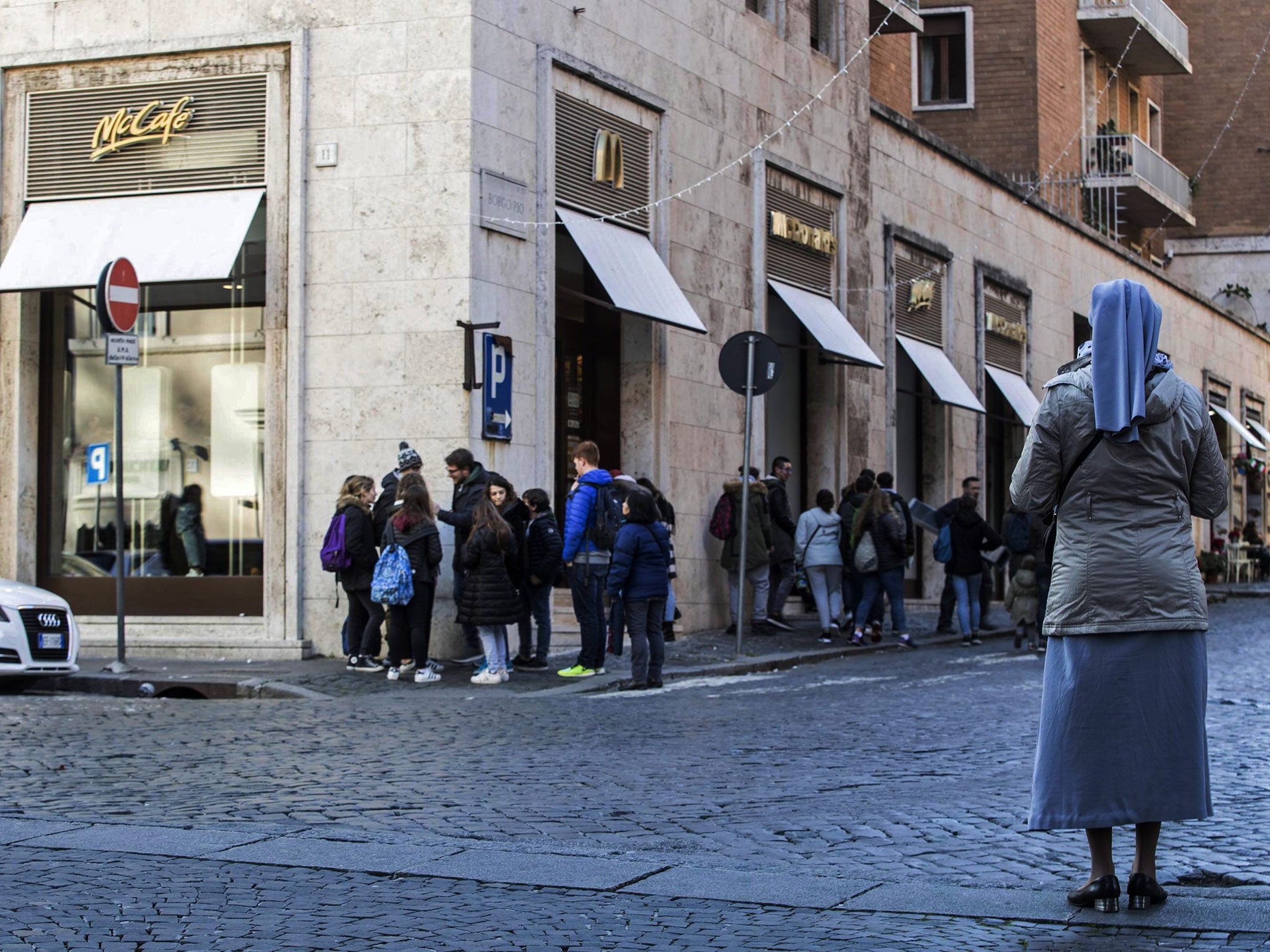 A nun seen near a newly opened McDonalds restaurant on the Borgo Pio, near the Vatican, Rome, Italy, 04 January 2017