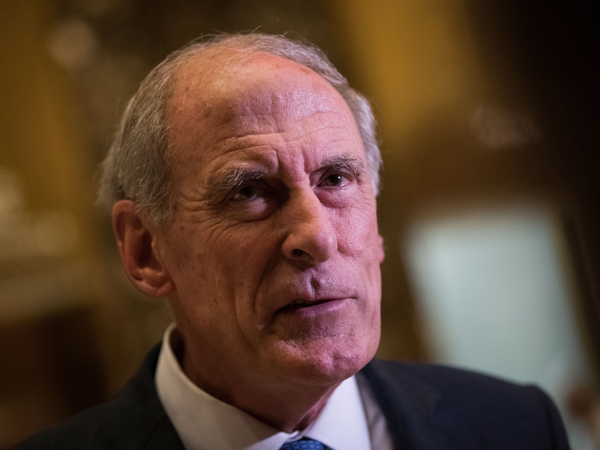 Dan Coats speaking to reporters at Trump Tower in Manhattan