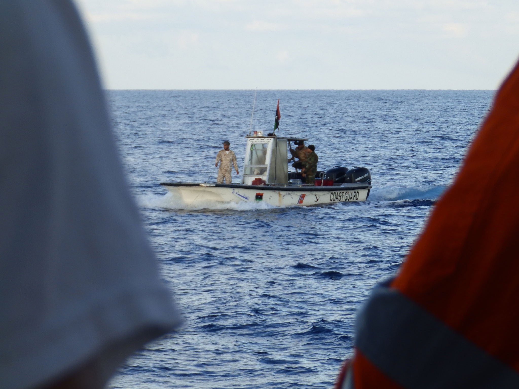 A Libyan coastguard boat observing a rescue by MSF's Bourbon Argos ship on 4 November 2016