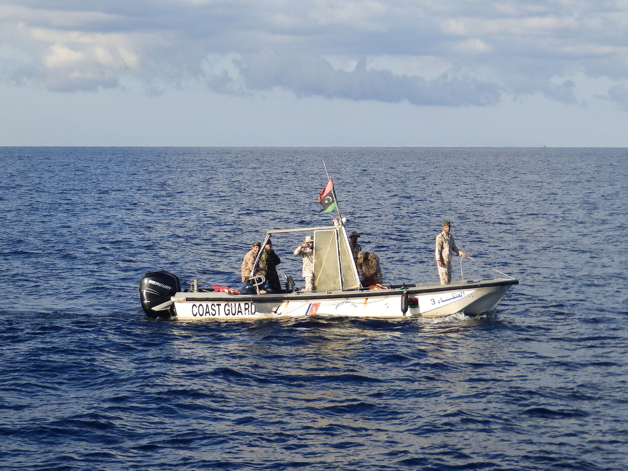 A Libyan coastguard boat filming a rescue by MSF's Bourbon Argos ship on 4 November 2016 (Lizzie Dearden )