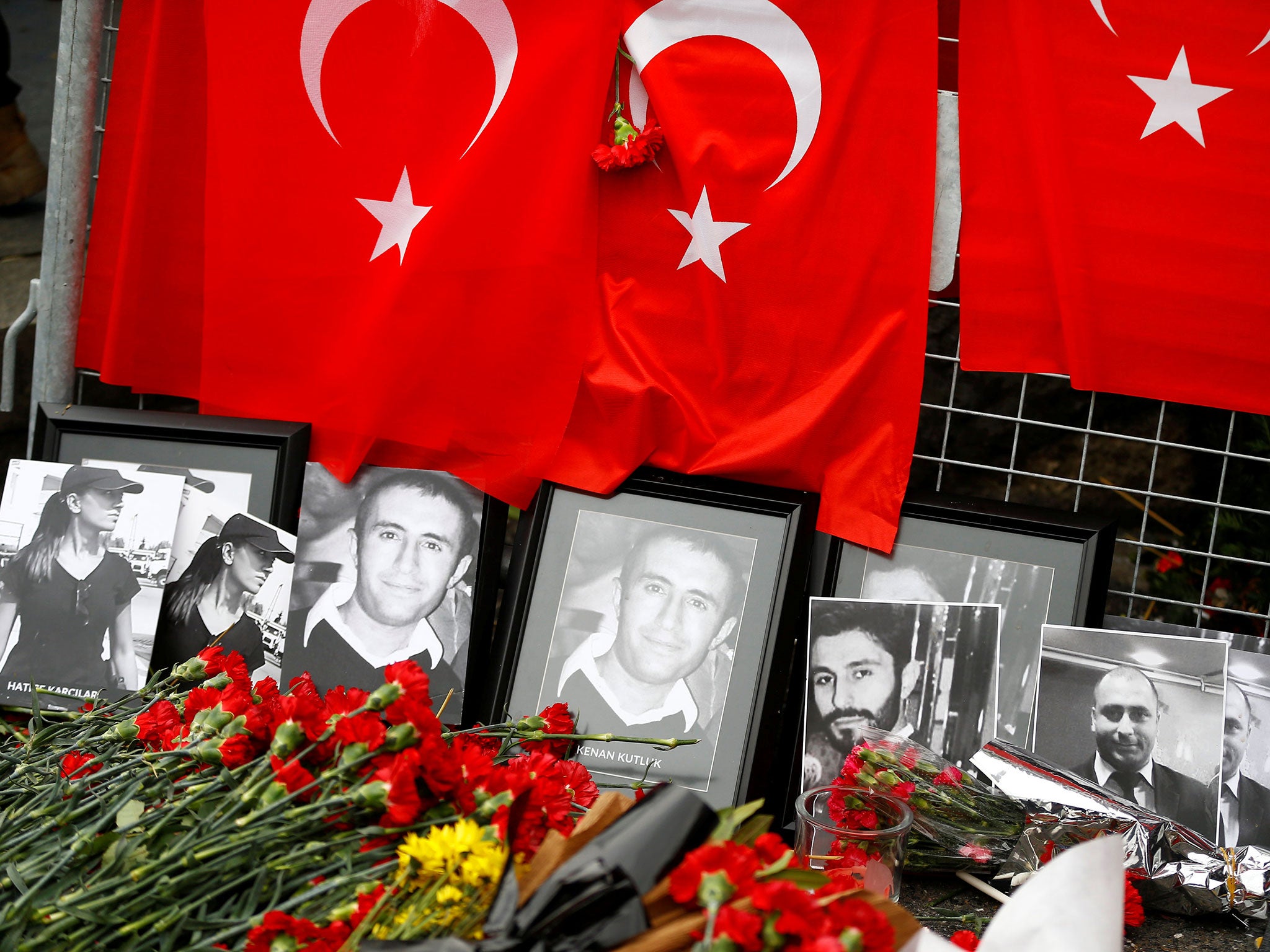 Tributes to the victims of the Reina nightclub massacre lay outside the venue