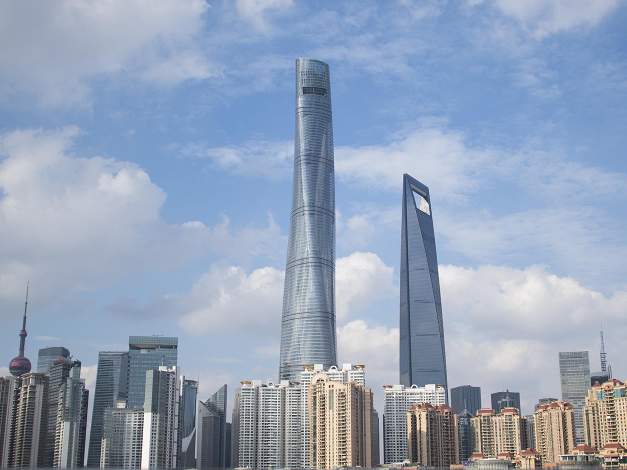 The Shanghai Tower (centre) holds the record for the fastest lift in the world. Companies have been rushing to service China’s many towering structures