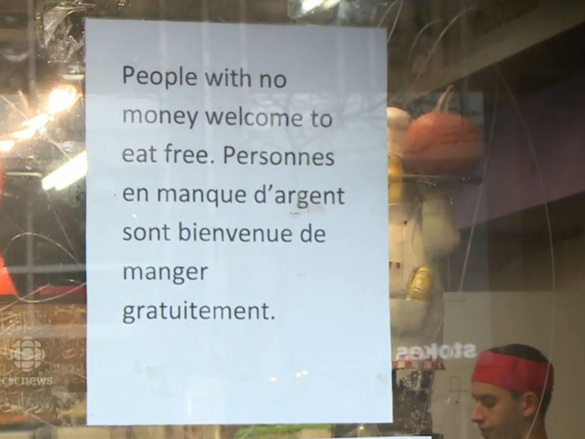 The sign outside Marche Ferdous in Montreal offering free food to those who need it