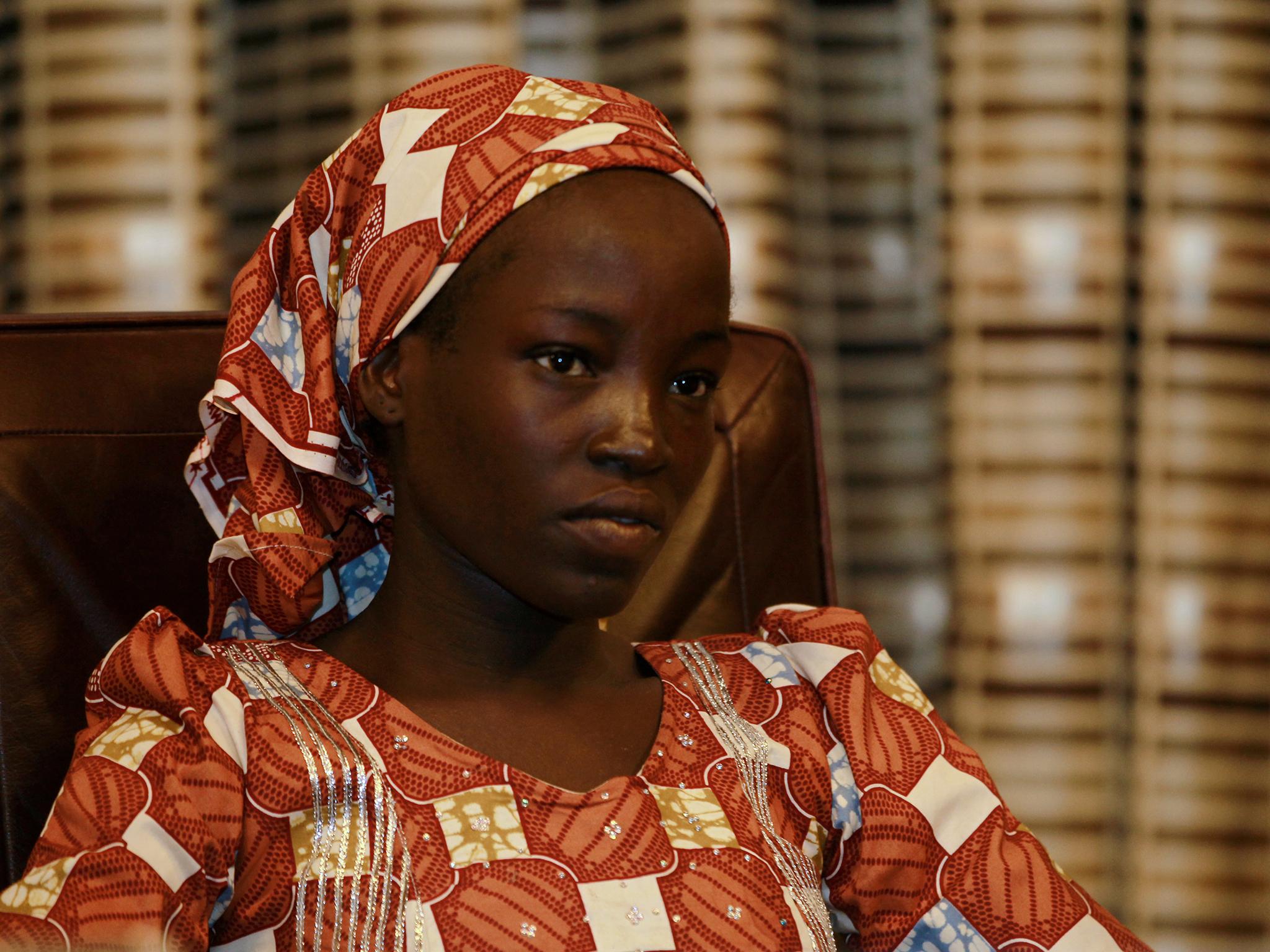 Amina Ali Darsha Nkeki, a Nigerian schoolgirl rescued after over two years of captivity with Boko Haram militants, looks on while visiting President Muhammadu Buhari in Abuja, Nigeria
