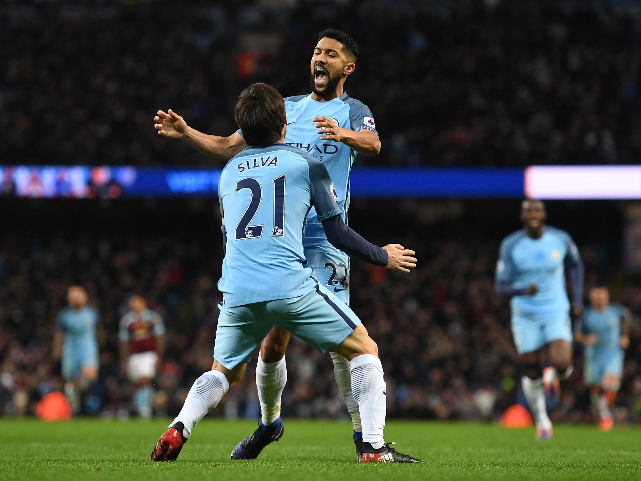 David Silva celebrates Manchester City's third with Gael Clichy