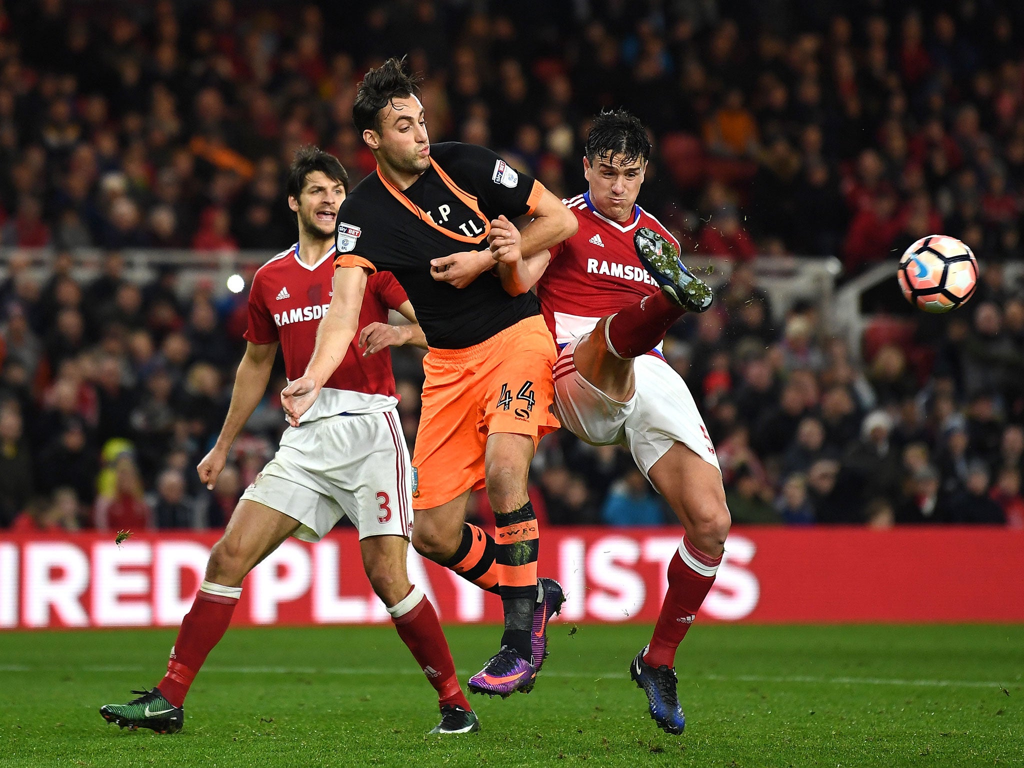 Bernardo Espinosa and Atdhe Nuhiu tussle for possession