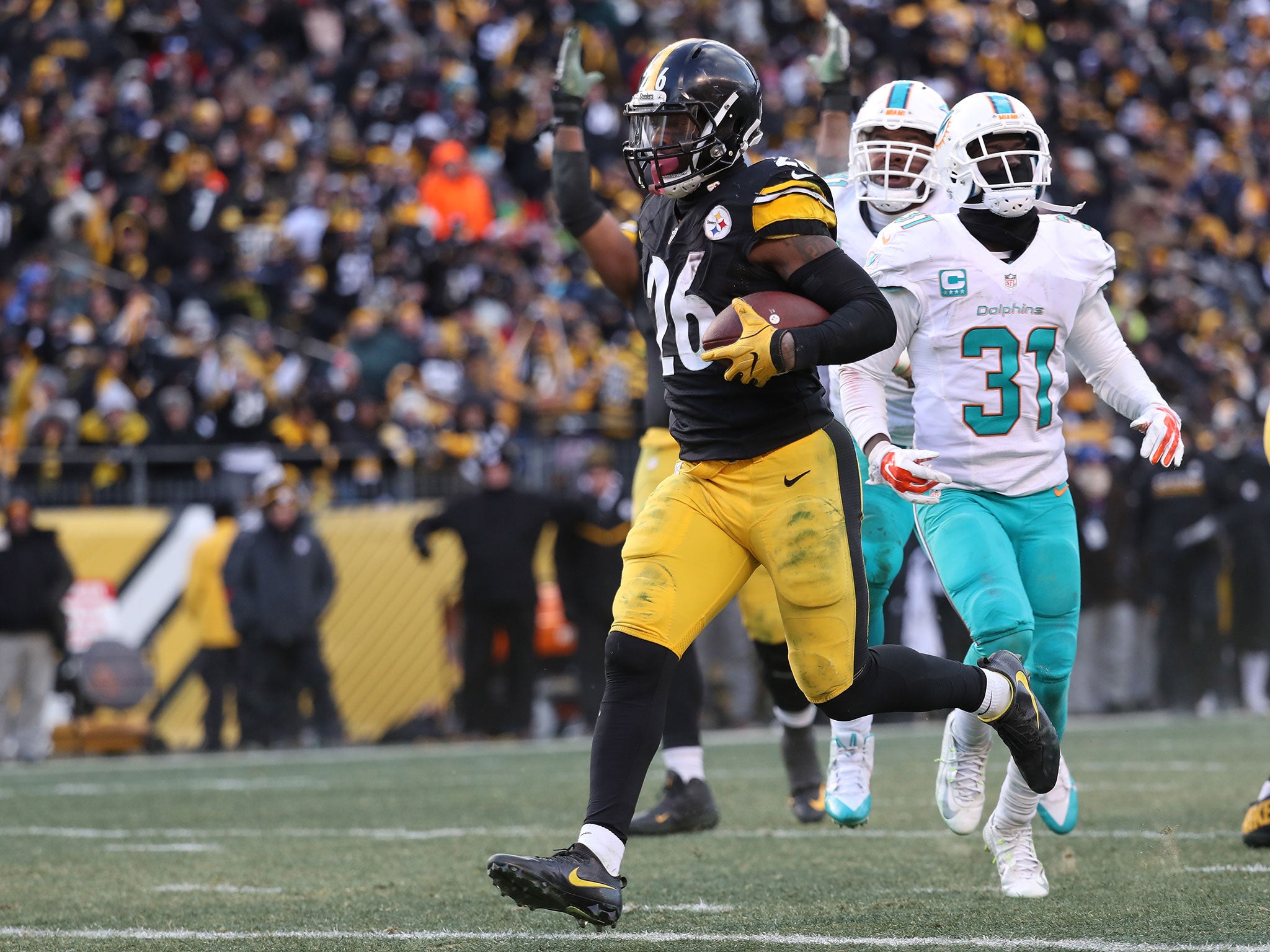 Le'Veon Bell ran in two touchdowns as he broke the Pittburgh record for the most yards in a postseason match