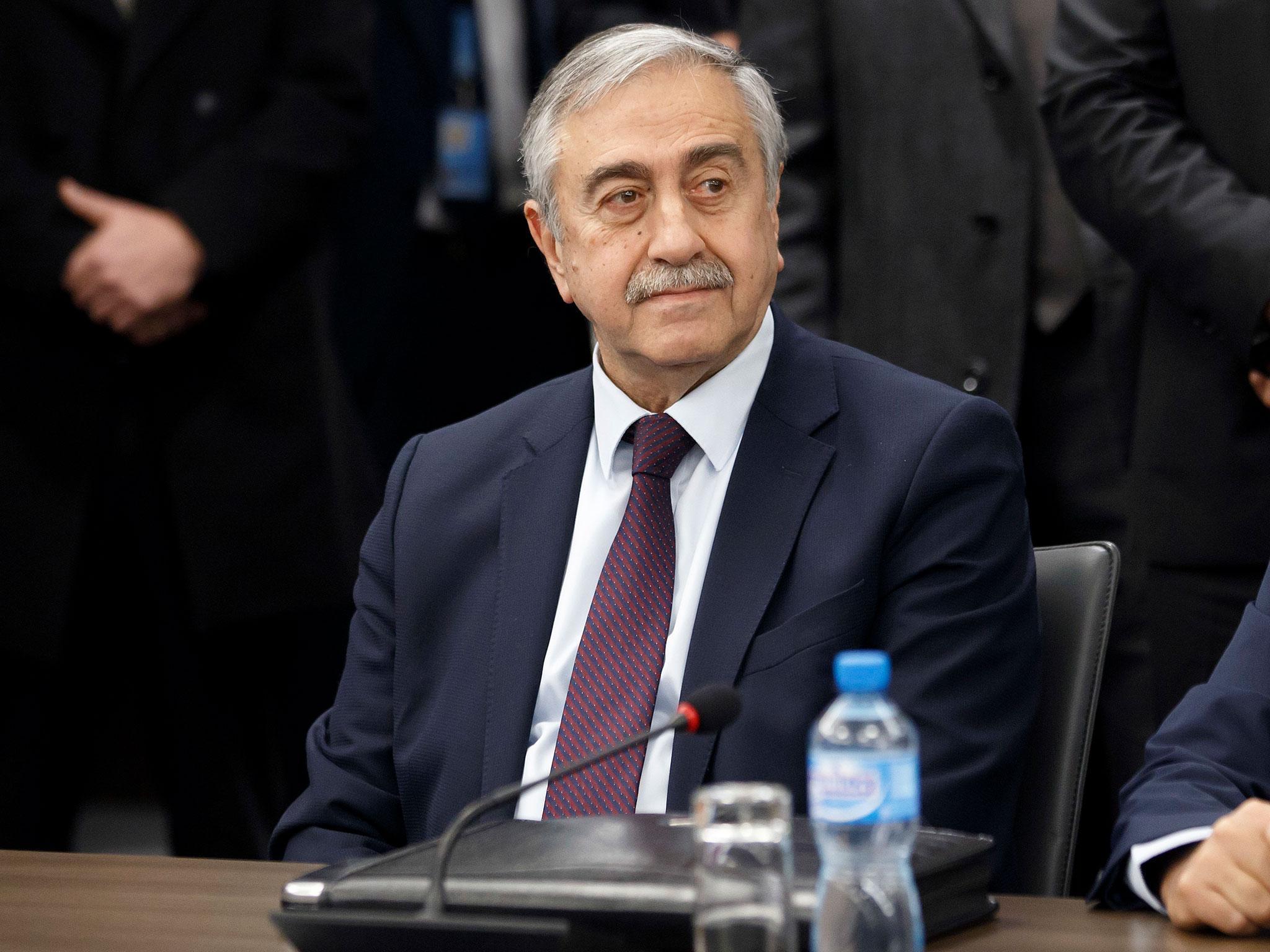 Turkish-Cypriot leader Mustafa Akinci waits for the start of a new round of Cyprus peace talks