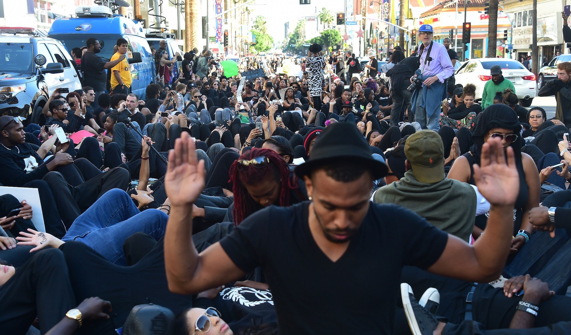 Protesters stage a sit-in in front of the Dolby Theater in Hollywood, California, on December 6, 2014. The group called BlackOutHollywood Against Police Brutality and its supporters, many dressed in black, marched along Hollywood Boulevard to protest against the deaths of unarmed African-American men at the hands of police officers in Los Angeles, New York and Ferguson, Missouri.