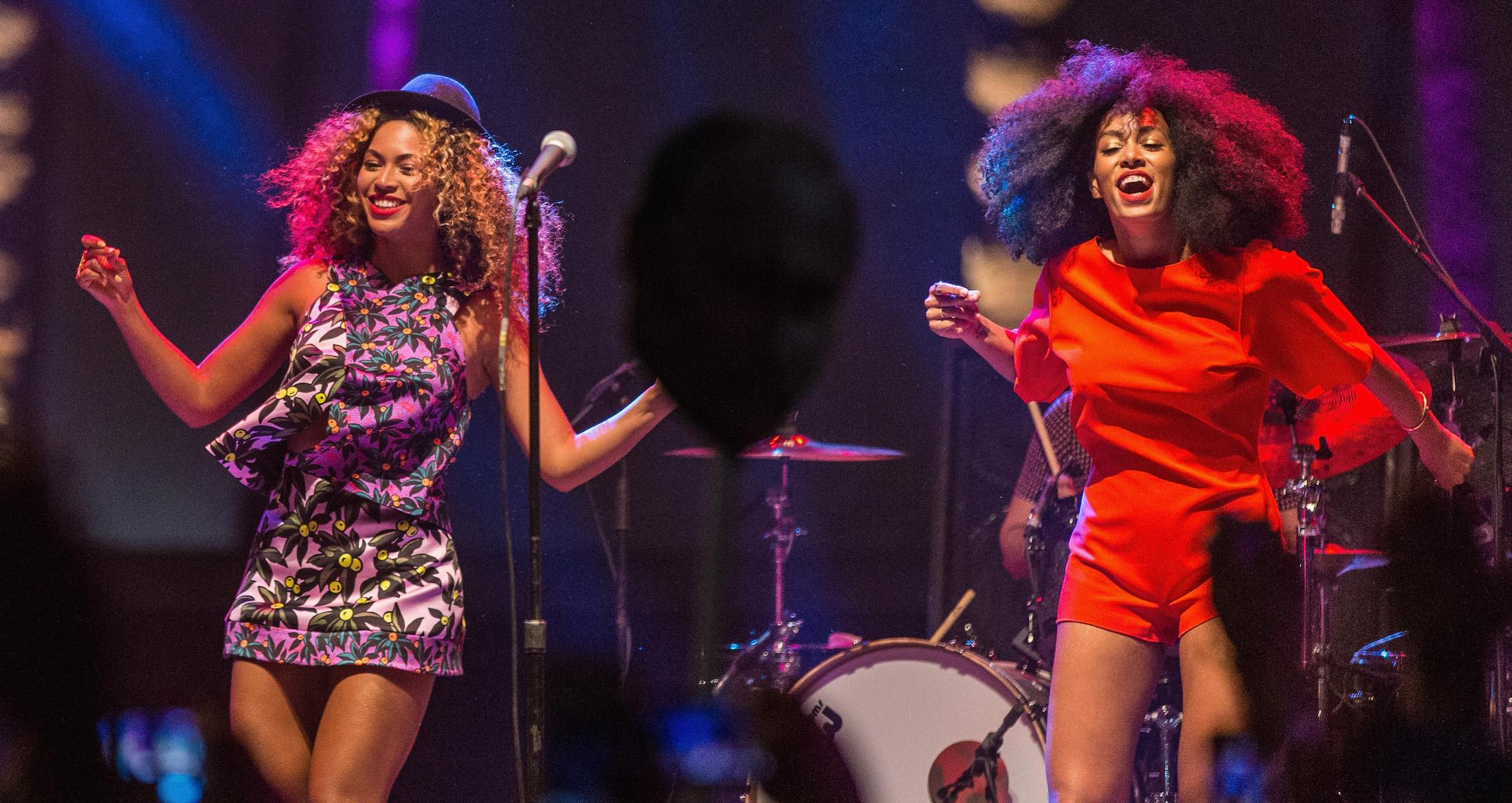 Singer Beyonce (L) performs with her sister Solange onstage during day 2 of the 2014 Coachella Valley Music & Arts Festival at the Empire Polo Club on April 12, 2014 in Indio, California.