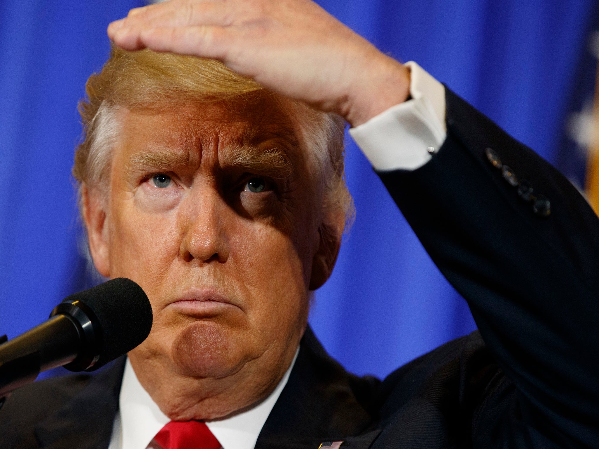 Donald Trump looks out at his first news conference since he was elected President