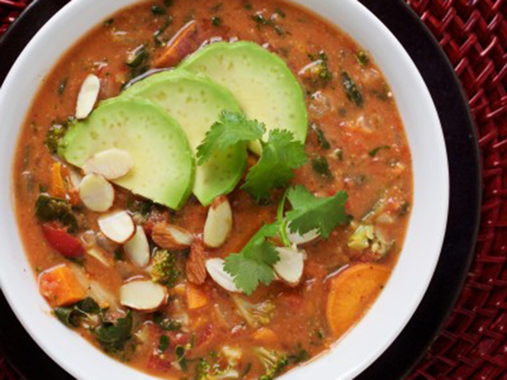 A garnish of avocado and almonds and cilantro completes a perfect wintry bowl