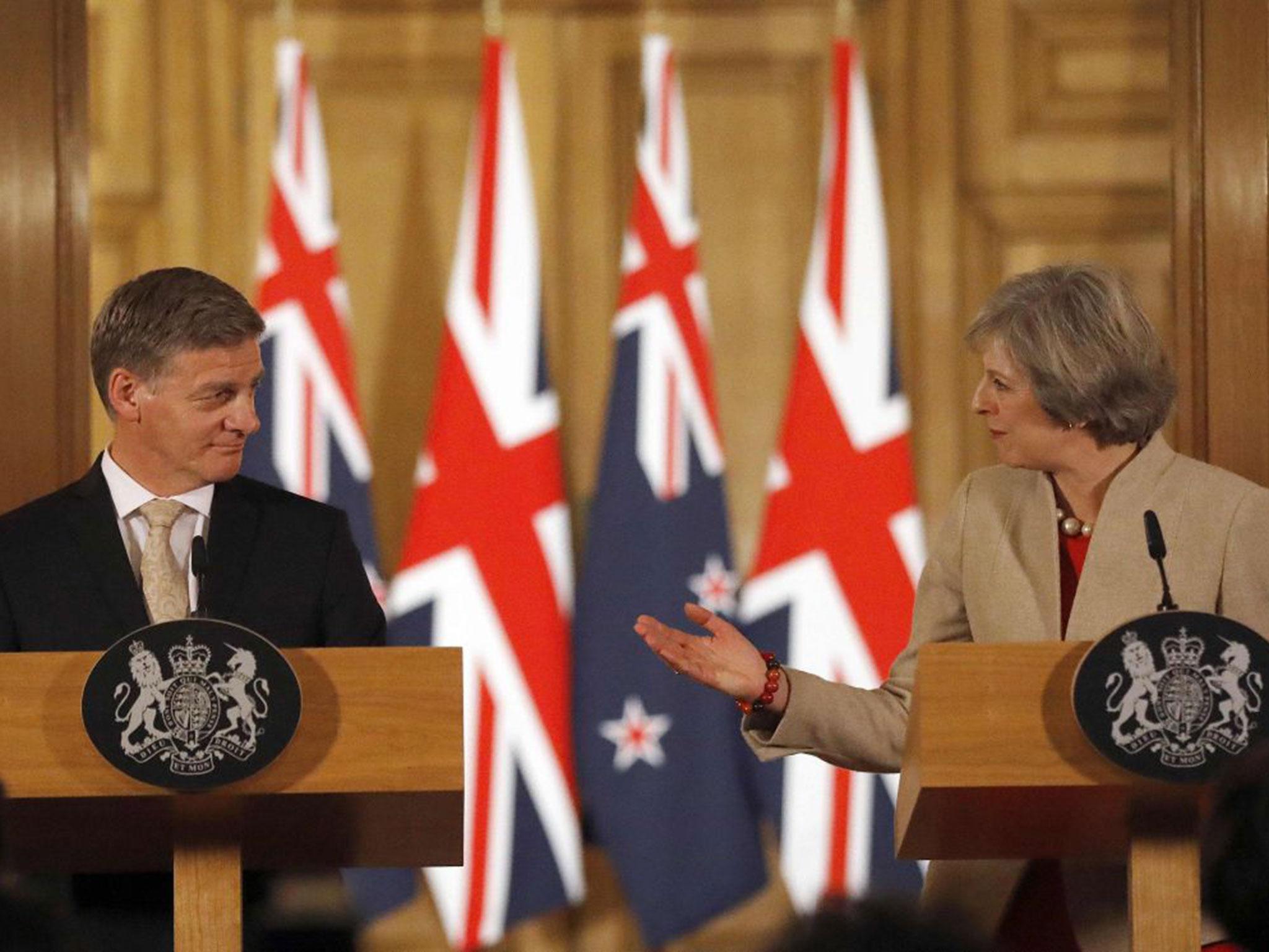 British Prime Minister Theresa May (R) and New Zealand Prime Minister Bill English give a press conference at 10 Downing Street in London