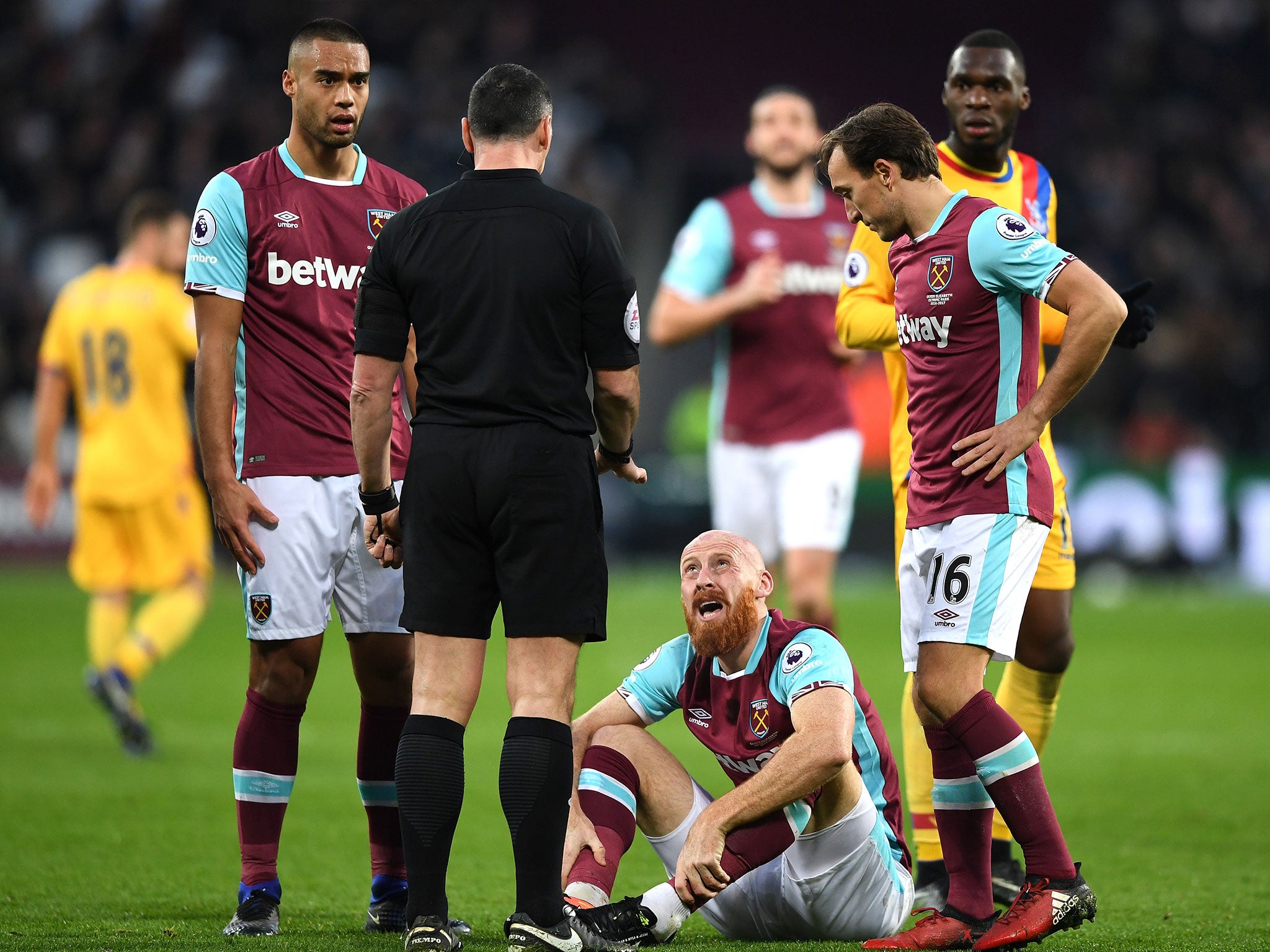 James Collins complains to referee Neil Swarbrick