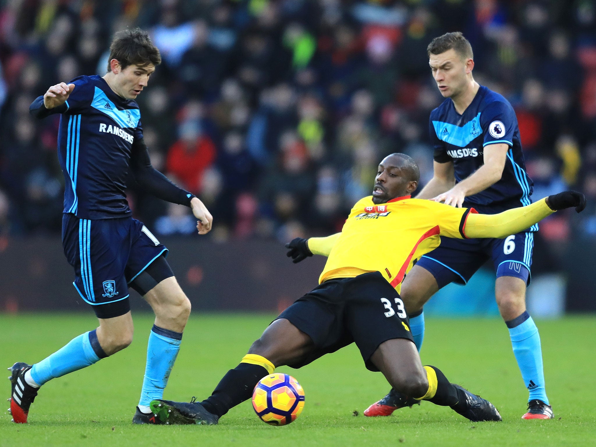 Marten de Roon and Stefano Okaka battle for possession