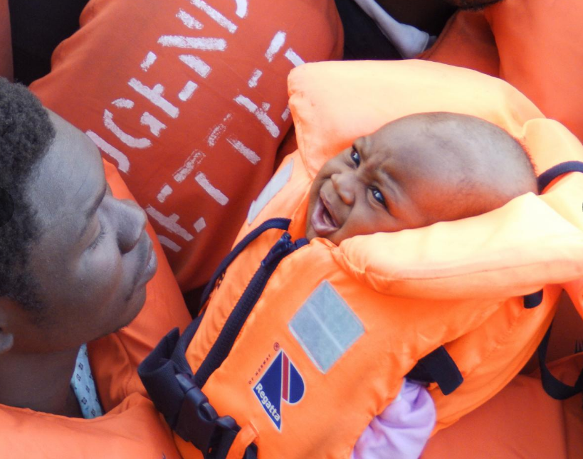 A baby among refugees on a boat carrying 185 people off the coast of Libya. Photo: Lizzie Dearden