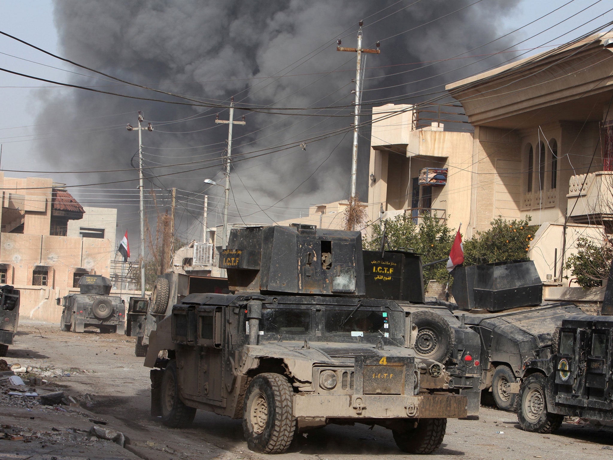 Smoke rises from an air strike during a battle with Isis militants in the Tahrer district of Mosul, Iraq, on 10 January