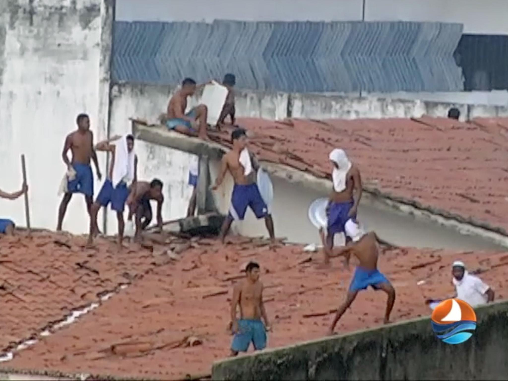 Television footage showed inmates on the roof of the prison