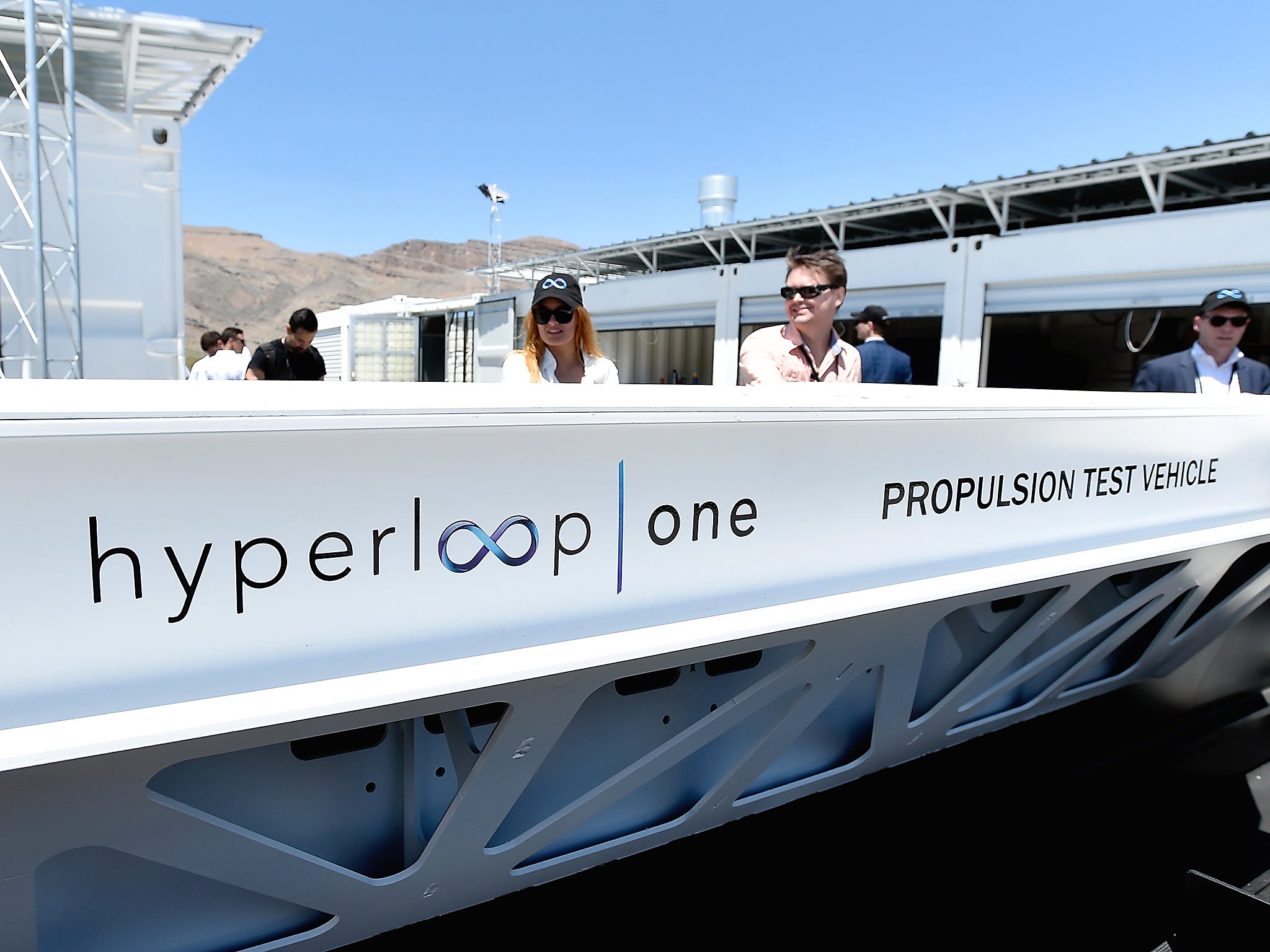 &#13;
People look at a demonstration test sled after the first test of the propulsion system at the Hyperloop One Test and Safety site in North Las Vegas, Nevada. The company plans to create a fully operational hyperloop system by 2020&#13;