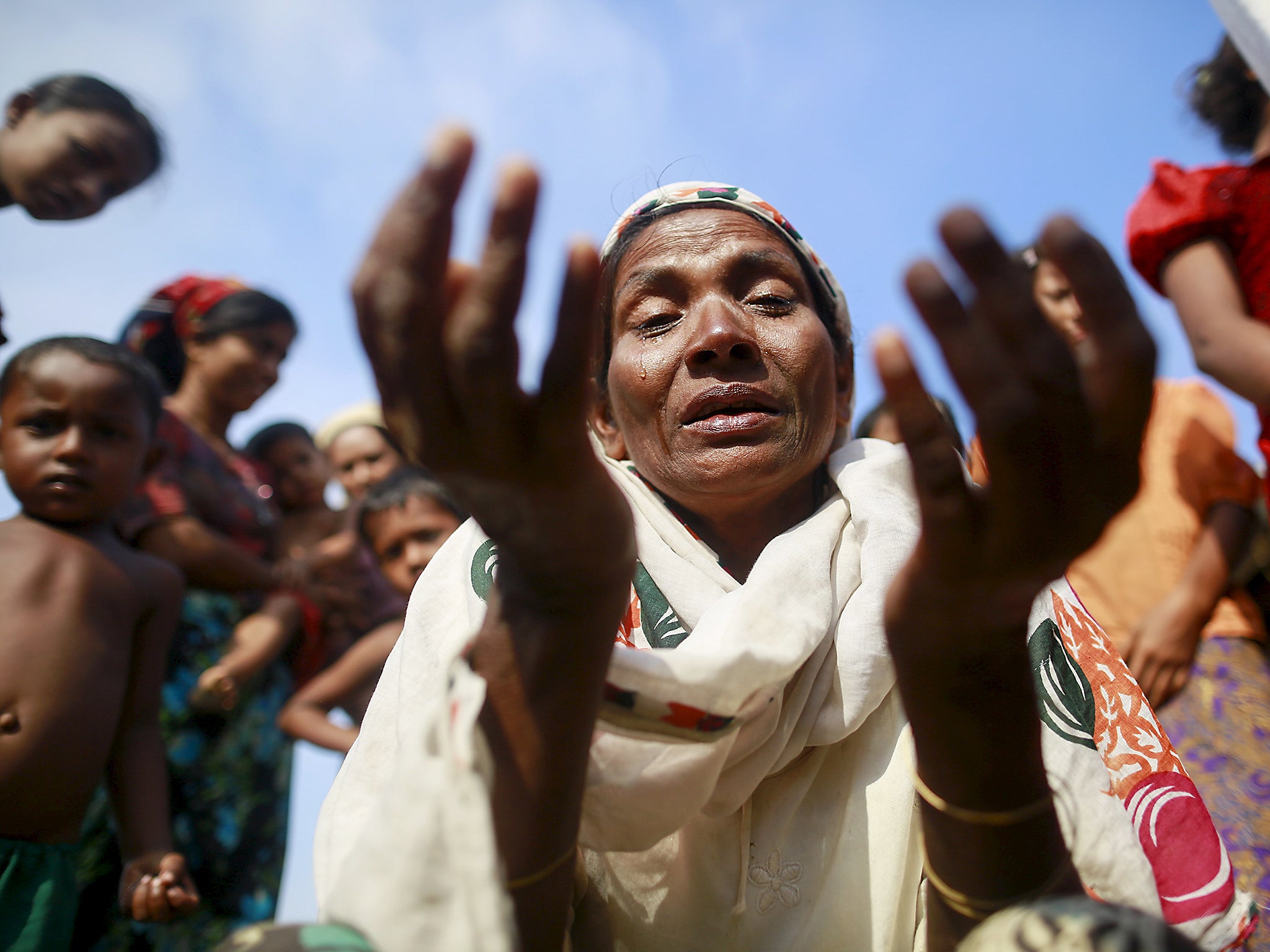 Zarli Hartu, 46, cries for her son Marmot Ismai, who she says was kidnapped into a human trafficking camp, at a refugee camp outside Sittwe