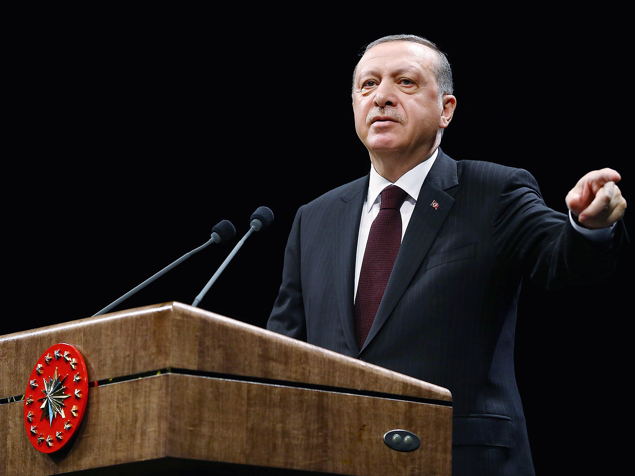 Turkey's President Tayyip Erdogan speaks during a meeting at the Presidential Palace in Ankara, Turkey