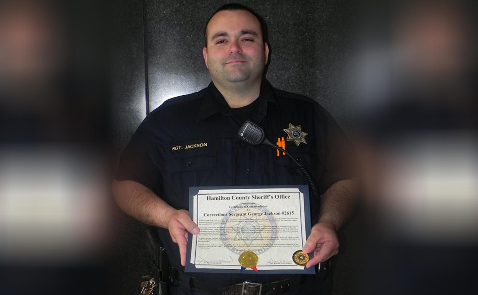 Corrections Sergeant George Jackson (center) receives commendation.