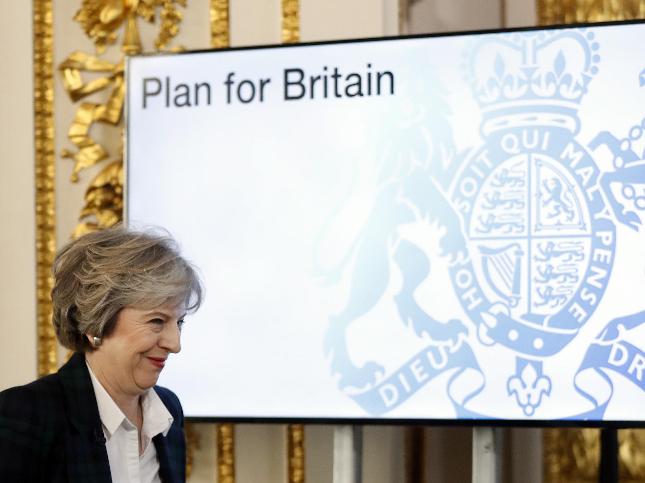 Britain's Prime Minister Theresa May smiles as she arrives to deliver a speech on leaving the European Union at Lancaster House in London