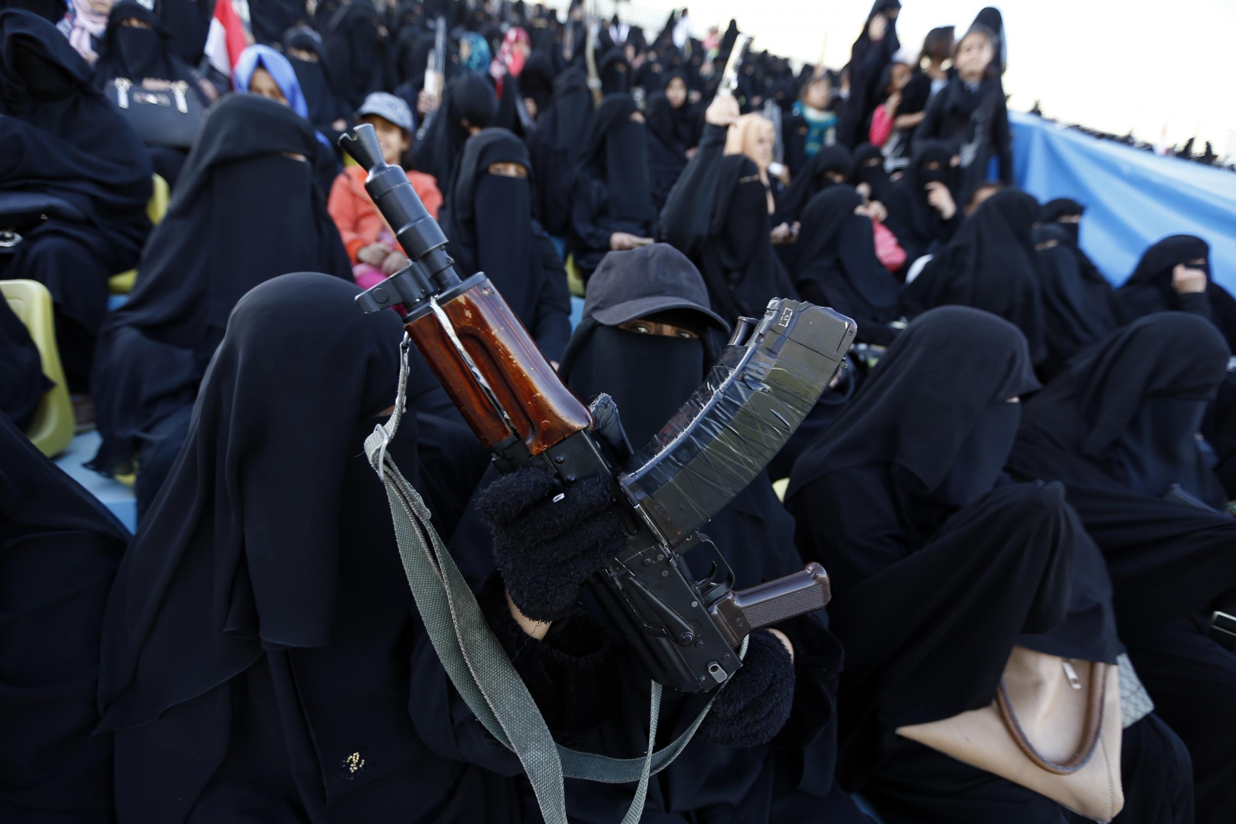 Women are pictured with children at the rally