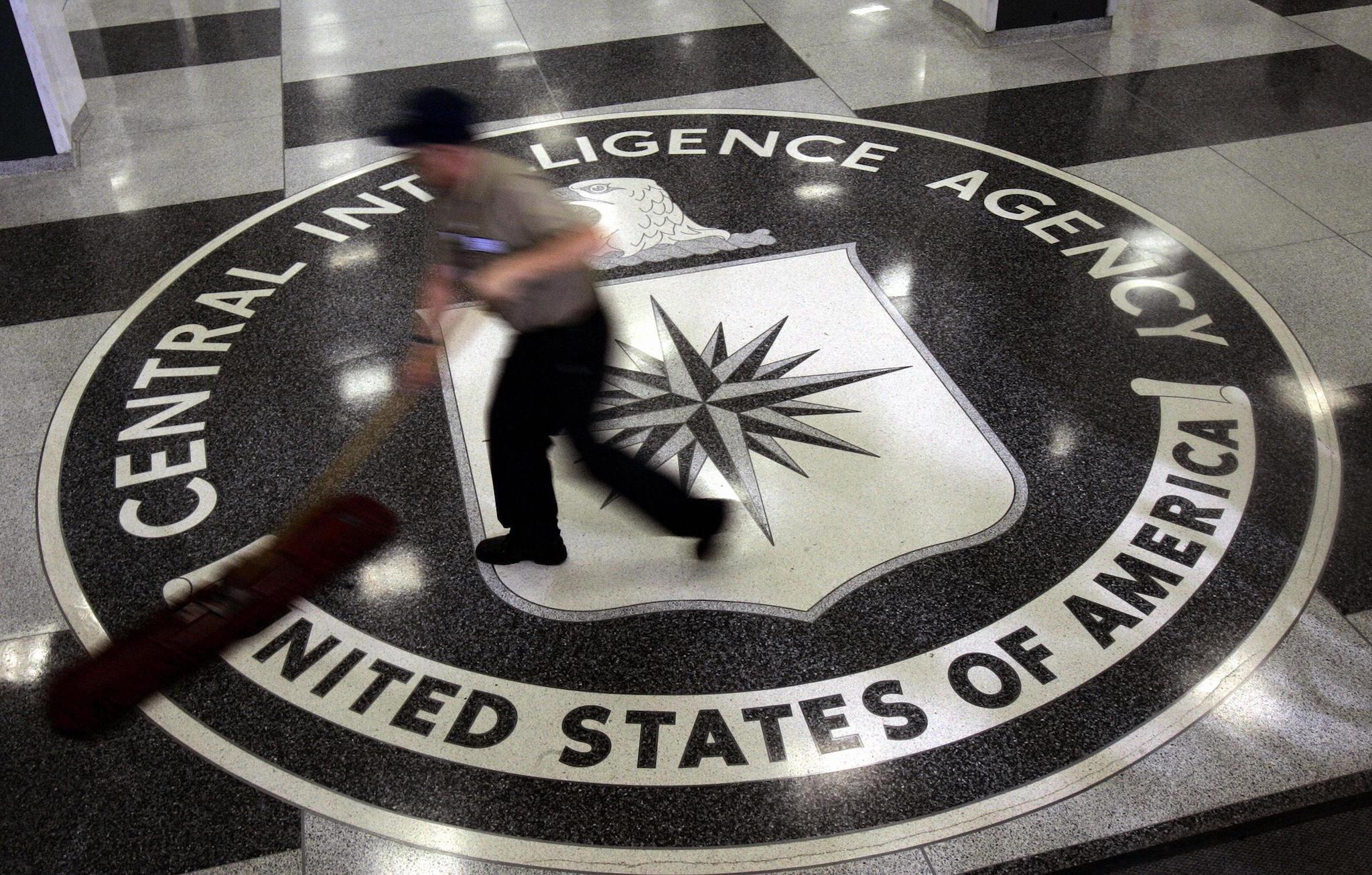 A janitor mops the floor at the headquarters of the Central Intelligence Agency