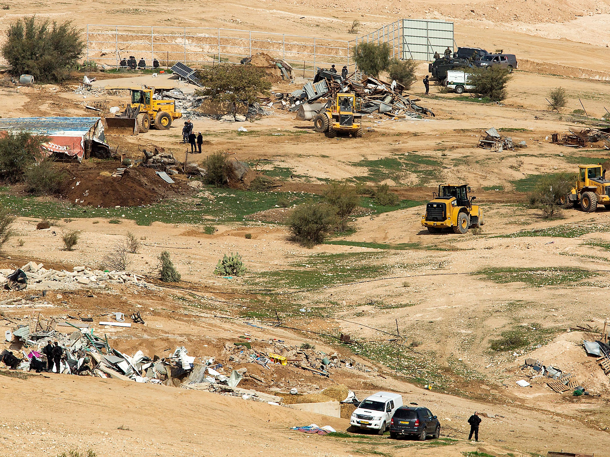 Bulldozers demolish Bedouin homes and structures in the illegal village of Umm al-Hiran in the Negev Desert, southern Israel