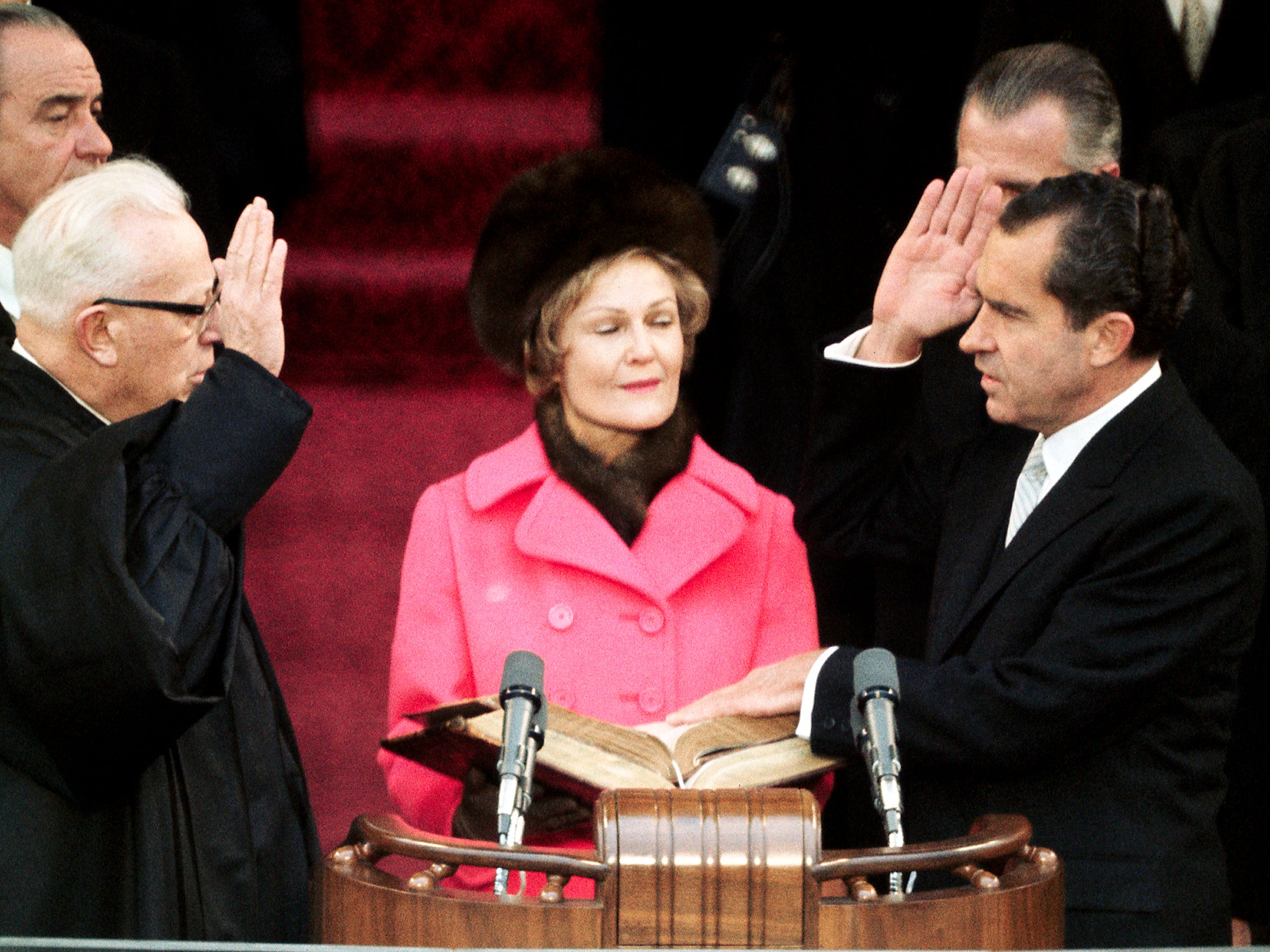 Chief Justice Earl Warren (left) swears in President Richard Nixon in 1969