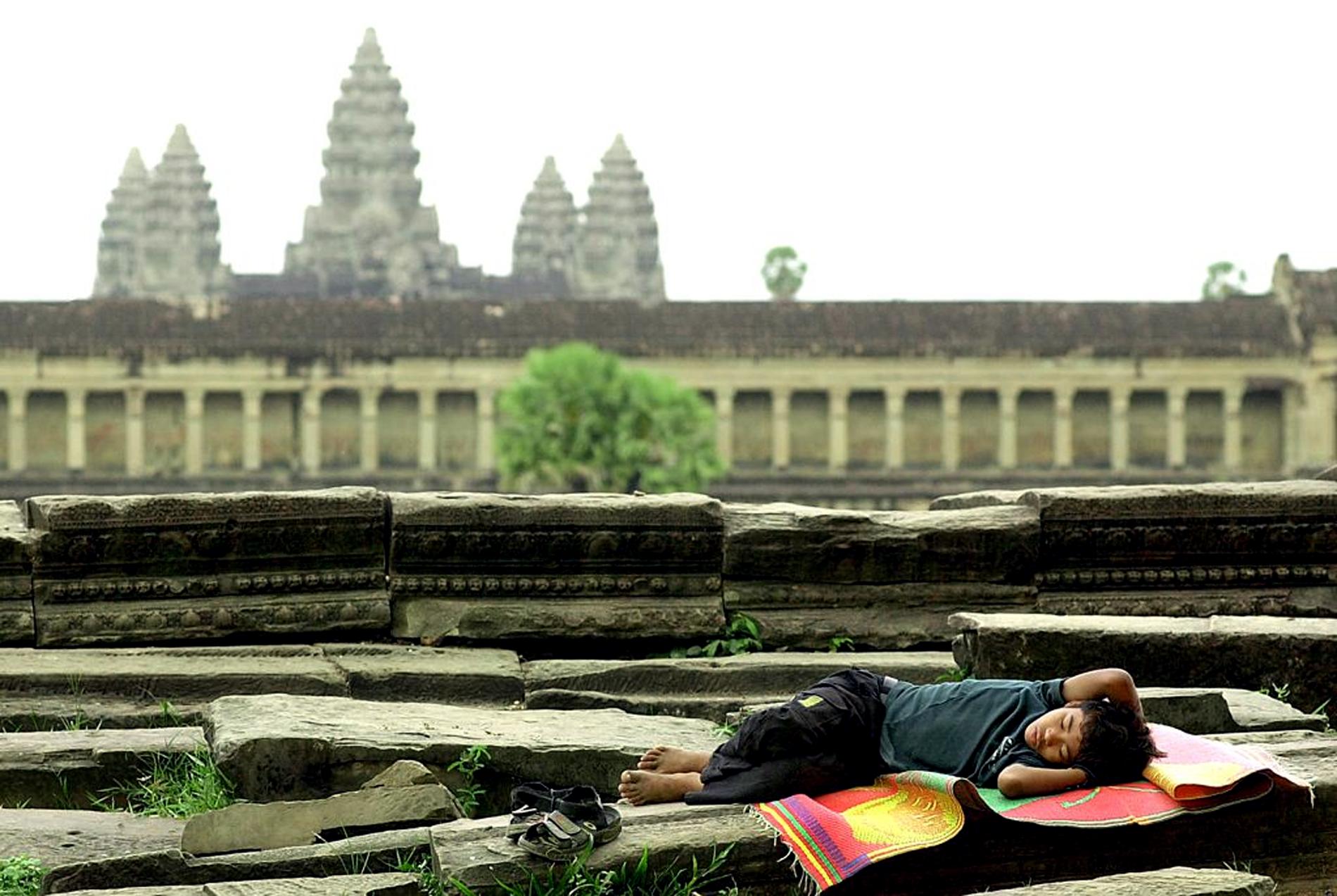 Buying souvenirs from children at Angkor Wat, Cambodia, can cause problems in the local community