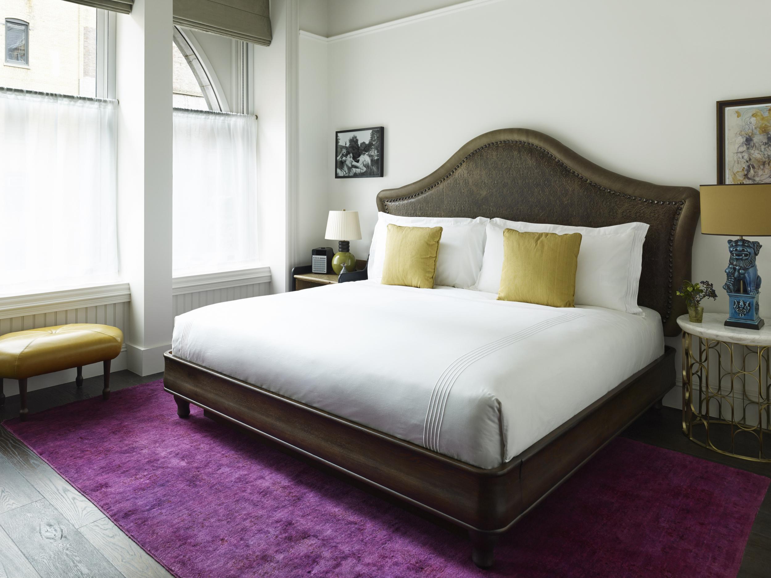 One of the hotel bedrooms, which are decorated with vintage furnishings