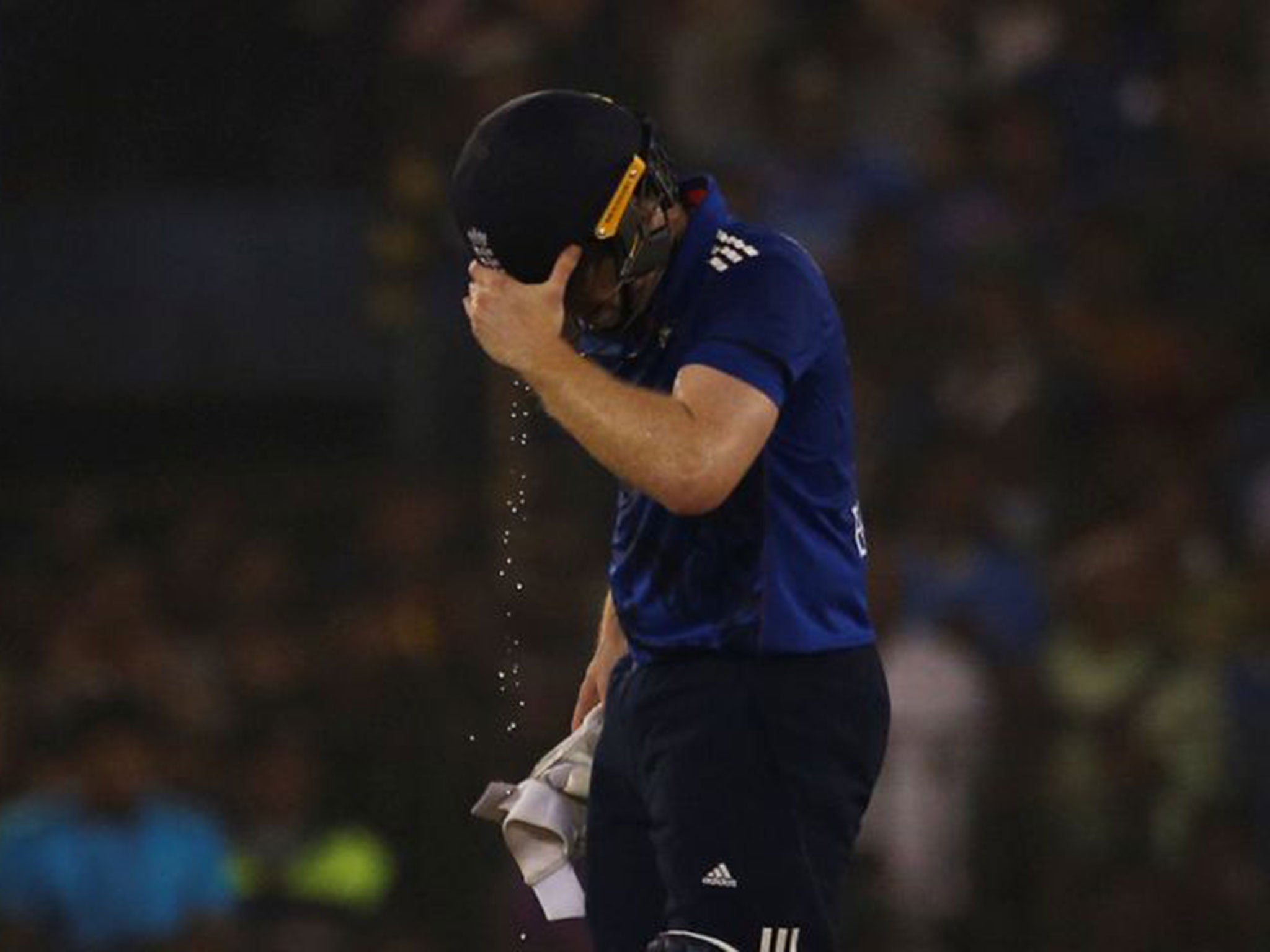 Eoin Morgan walks off dejected after being run-out at the non-striker's end