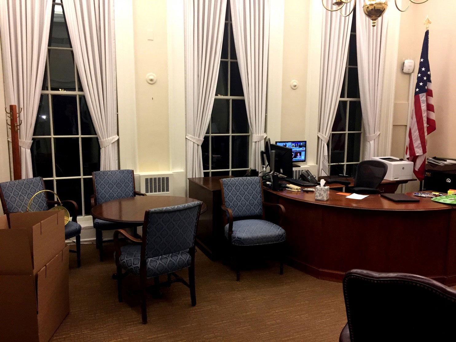 A moving box stands in the corner of White House press secretary Josh Earnest's office