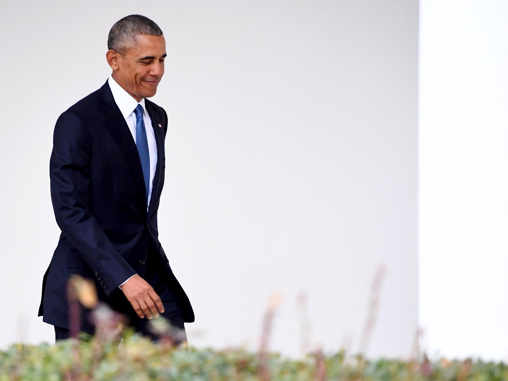 US President Barack Obama departs the Oval Office for the last time as president, at the White House in Washington, DC January