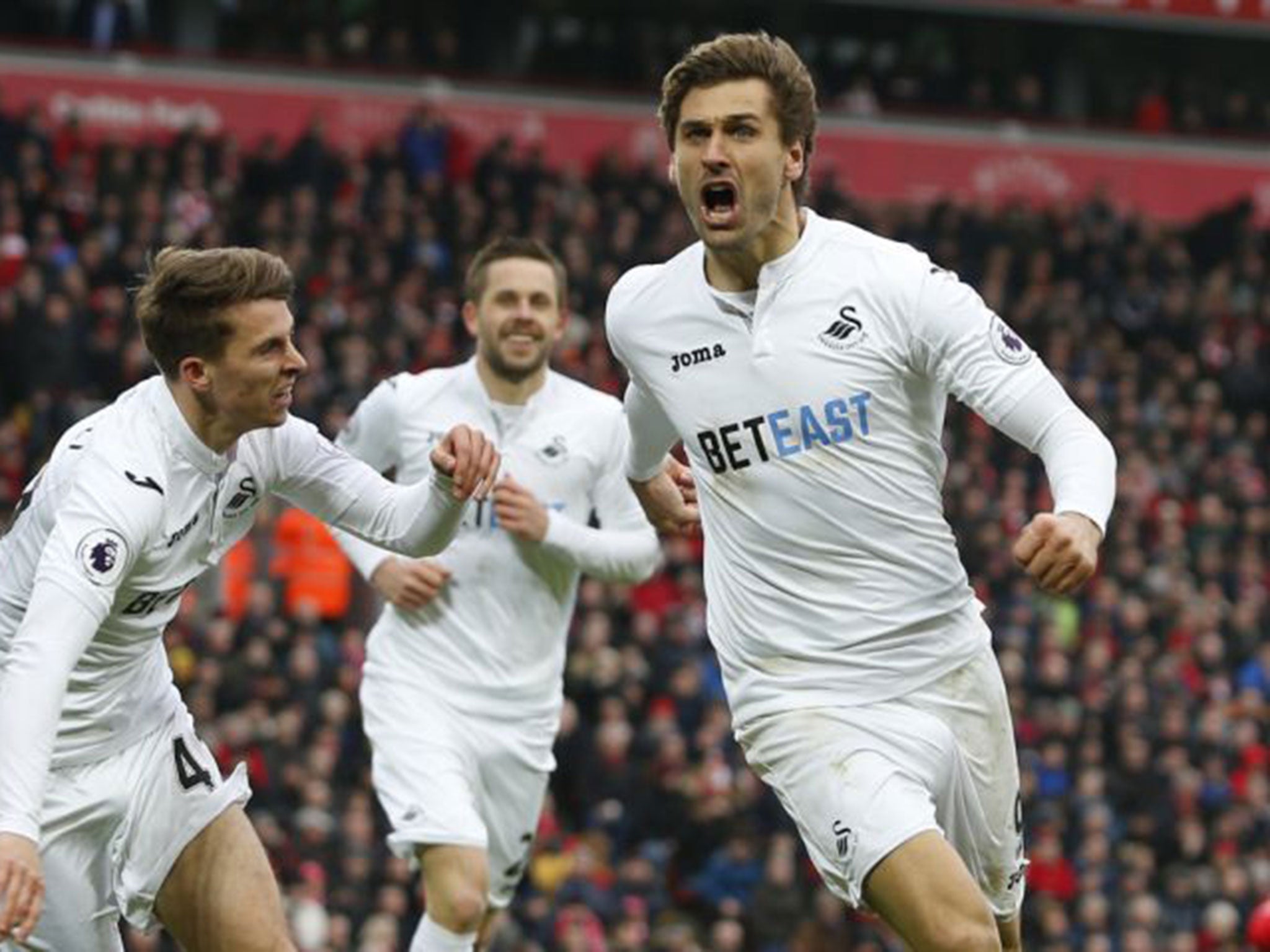 Fernando Llorente celebrates after scoring his second goal against Liverpool