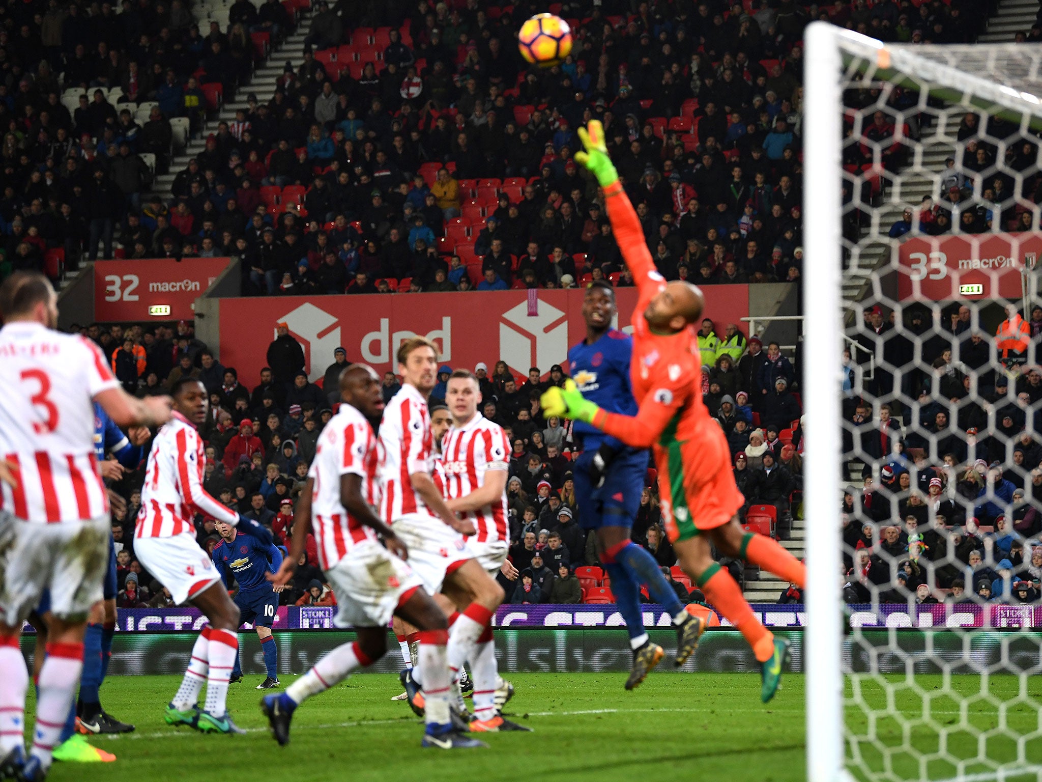 Rooney's free-kick curls over the hand of Lee Grant and into the back of the net