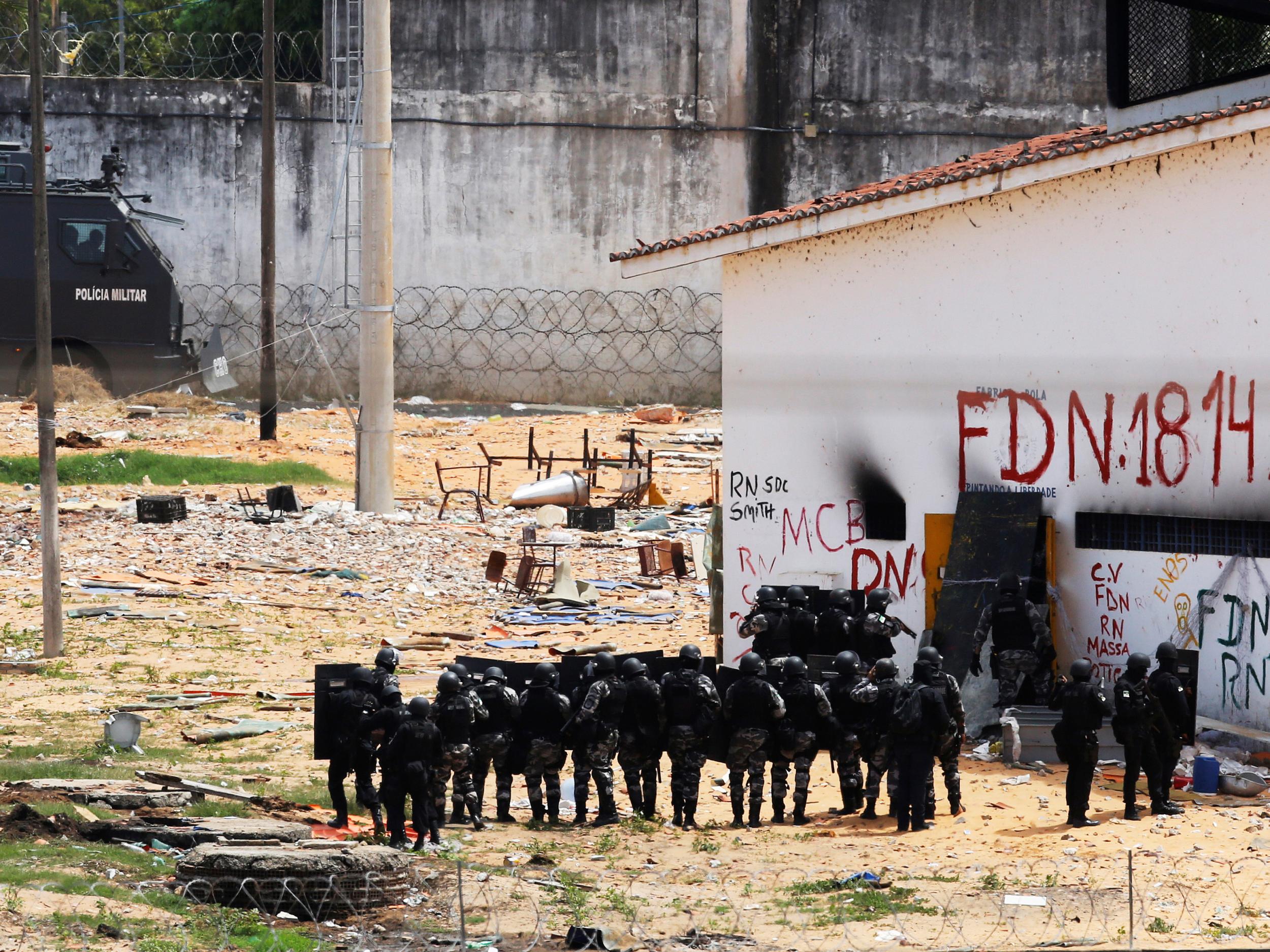 Riot police during an uprising at Alcacuz prison