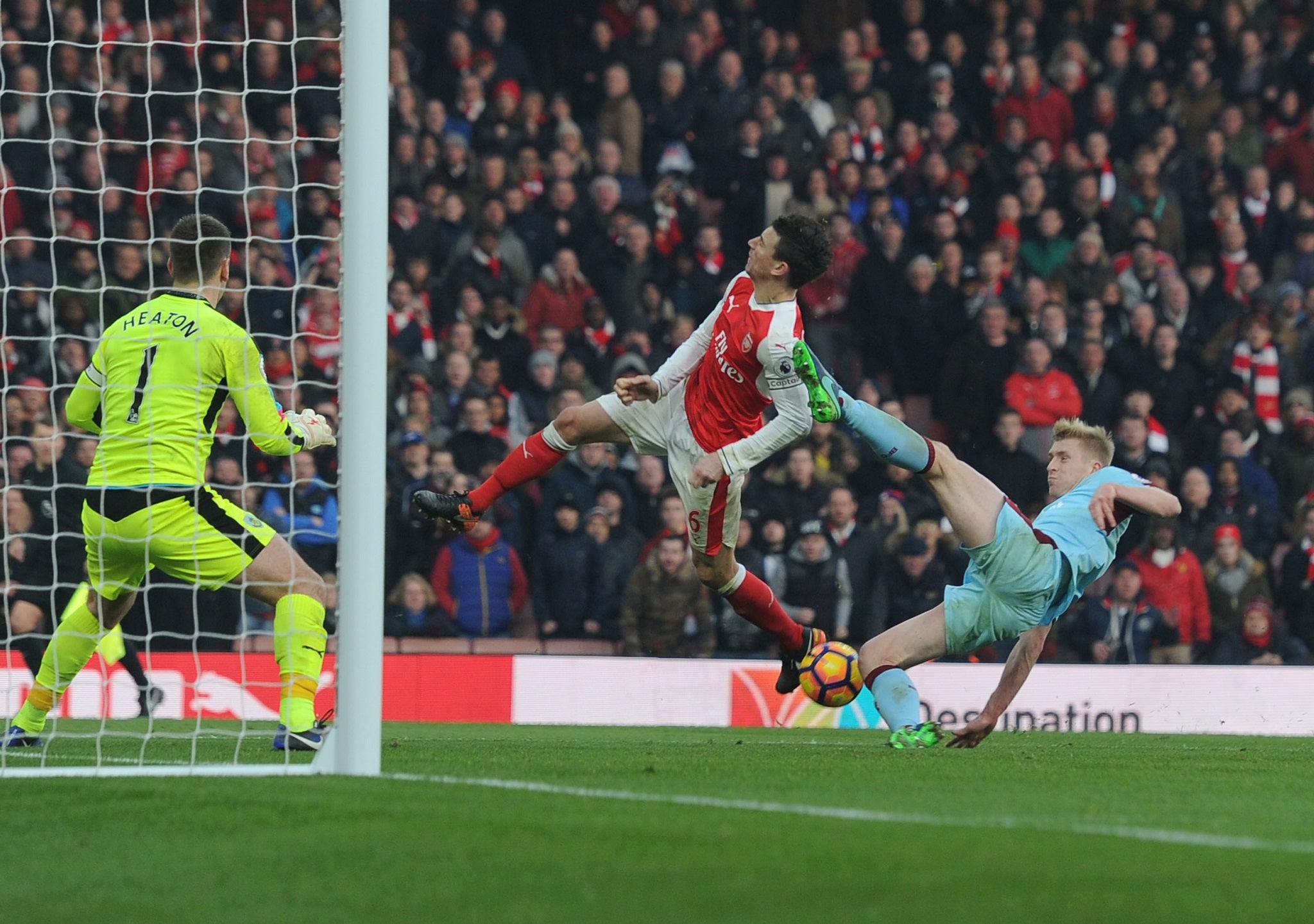 Laurent Koscielny was caught by a high foot from Ben Mee to win Arsenal a penalty despite being offside