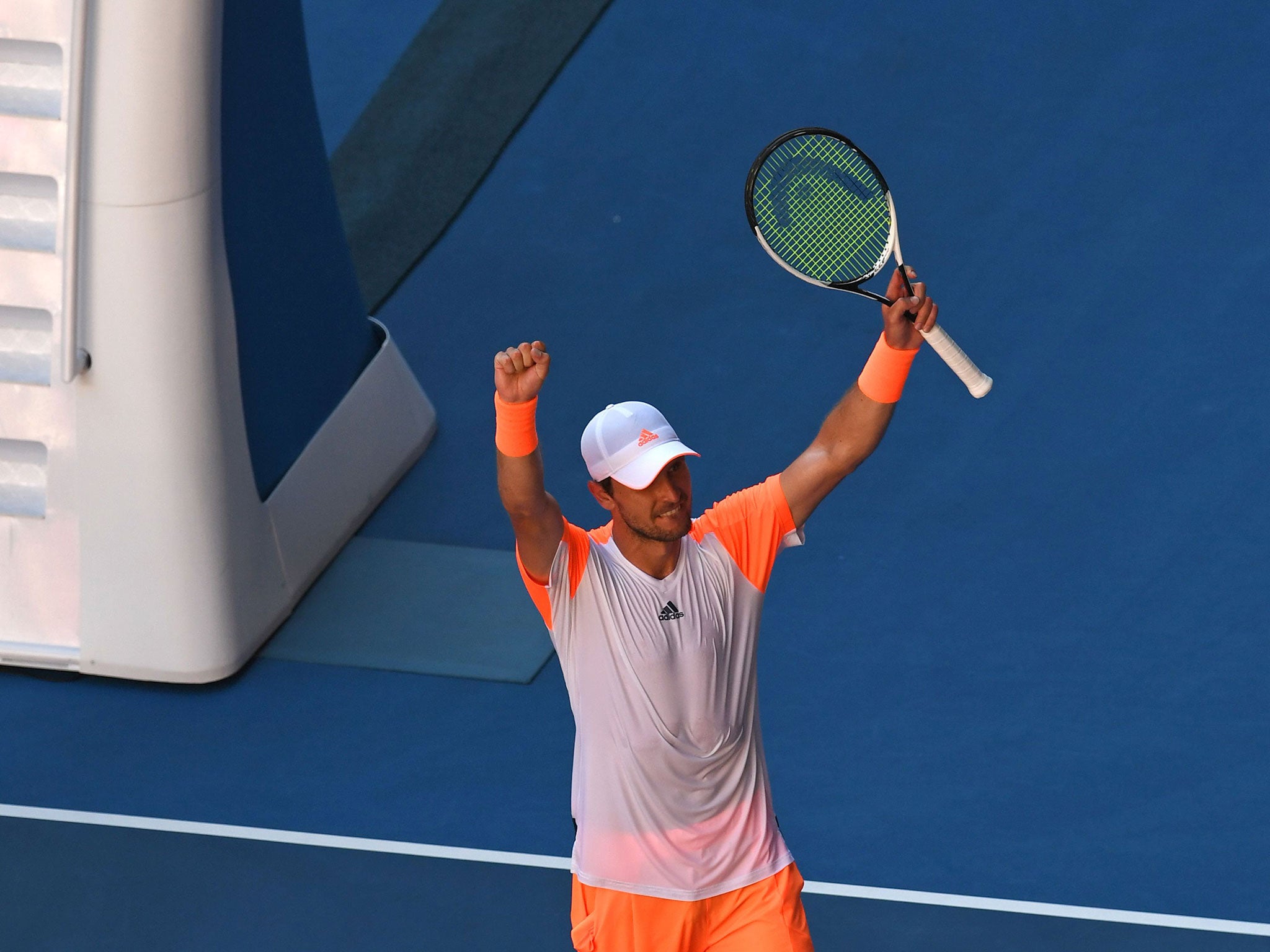 Mischa Zverev celebrates after beating Murray