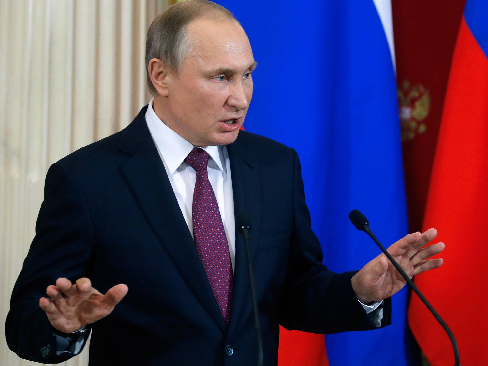 Russian President Vladimir Putin gestures as he speaks at the Kremlin in Moscow on January 17, 2017