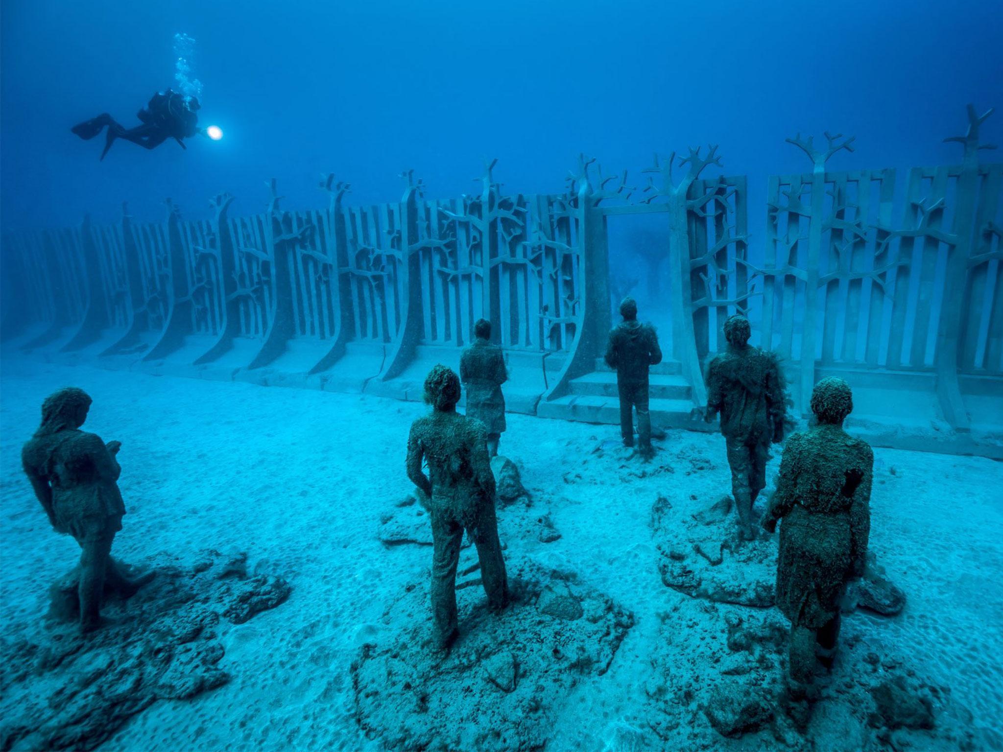 One of the new installations, Crossing the Rubicon, features 35 figures walking towards a gateway in a 30m-long, 100-tonne wall. The work is illustrative of the effects of climate change, and humankind's tendency to ignore responsibility towards it.