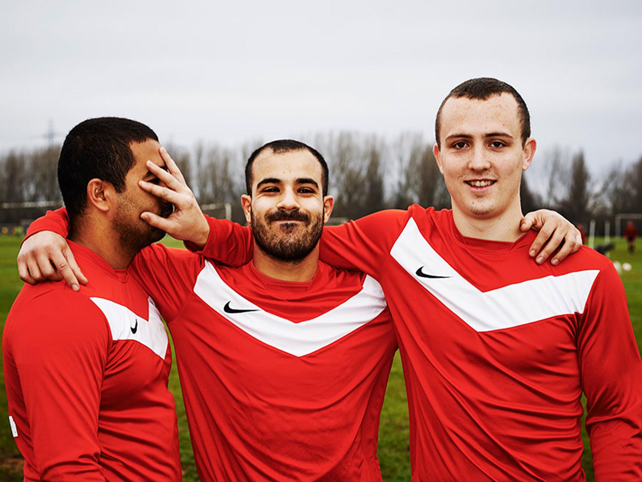 Team mates joke around on Hackney Marshes in East London