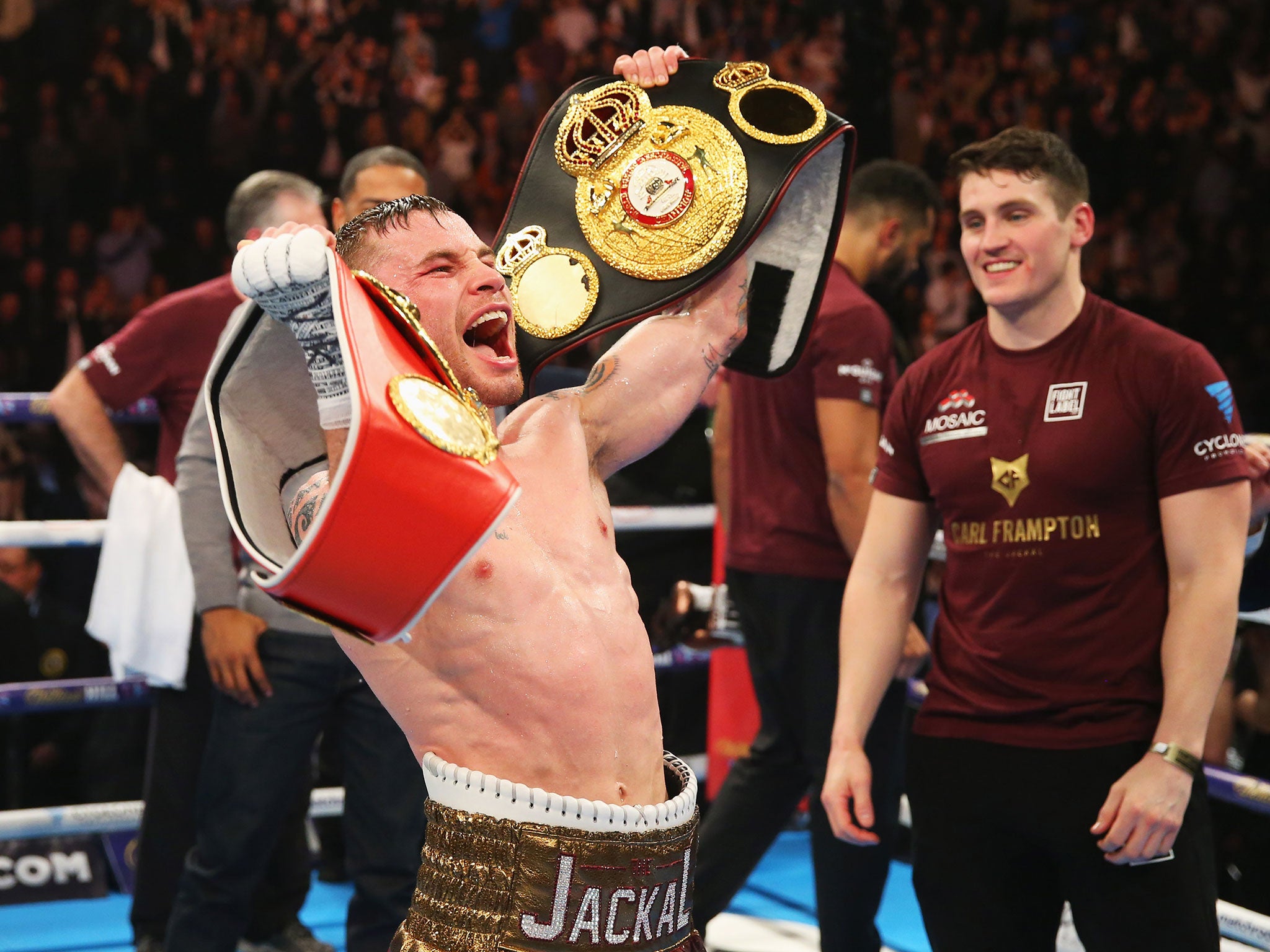 Frampton celebrates with his belts following a points victory over Scott Quigg after their World Super-Bantamweight title contest at Manchester Arena on February 27, 2016